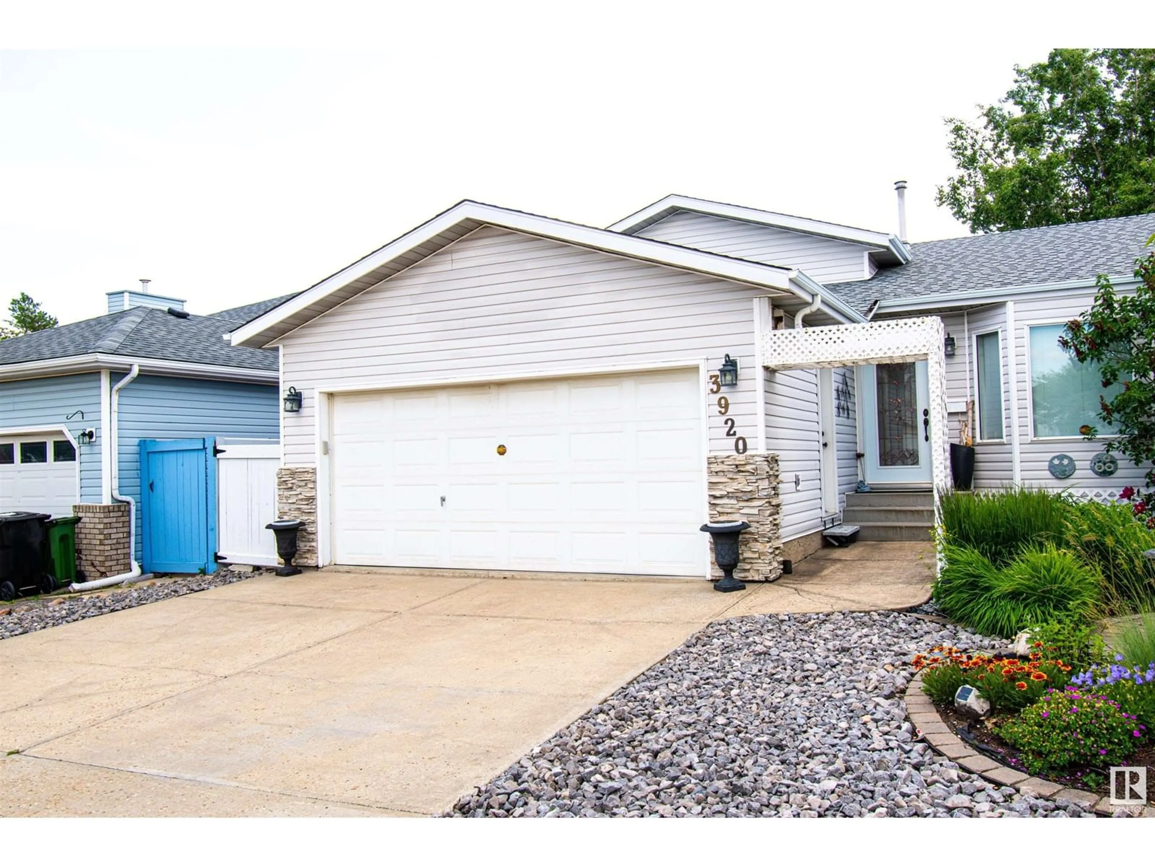 Home with vinyl exterior material, street for 3920 33 NW, Edmonton Alberta T6T1J7