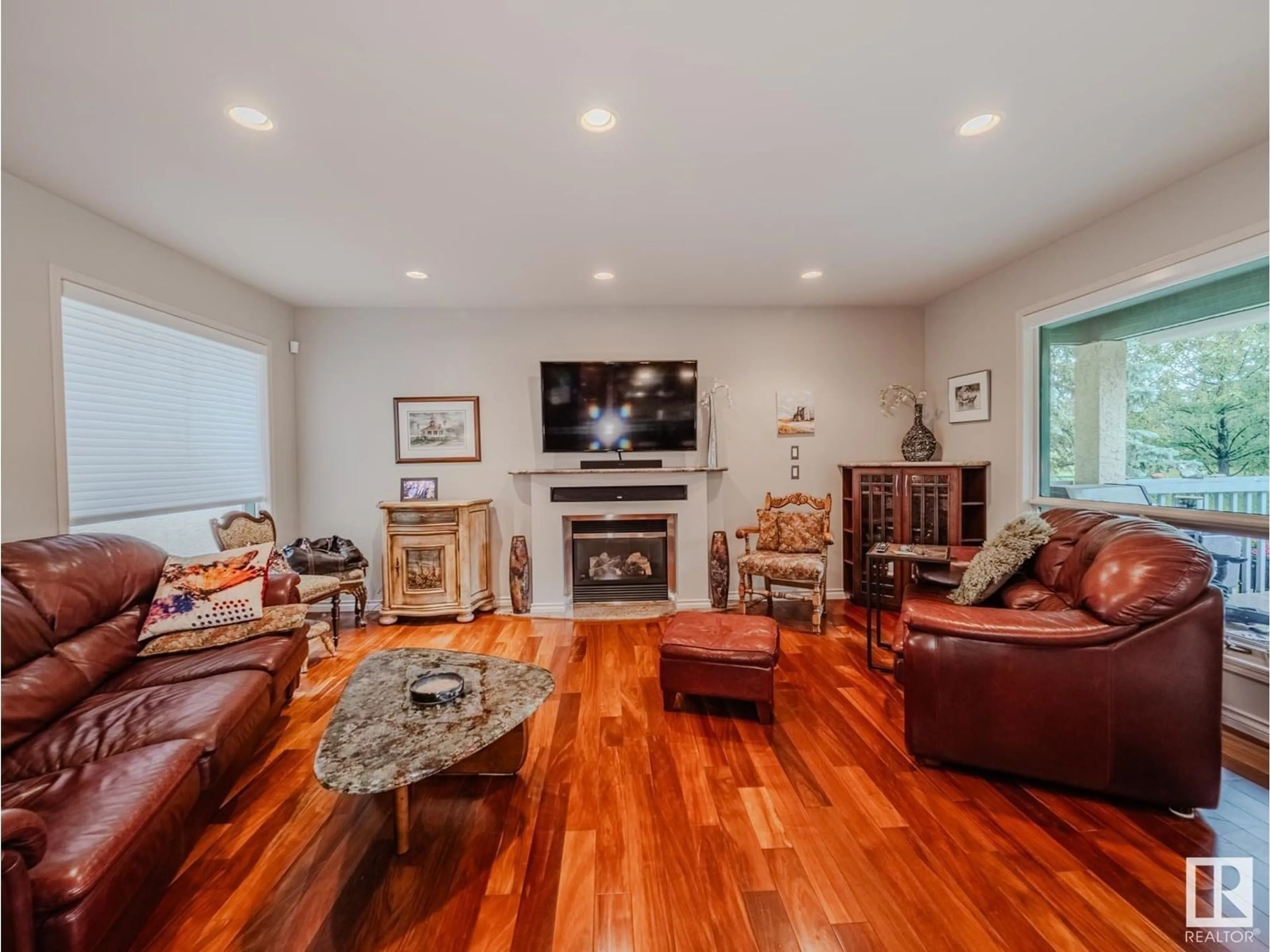 Living room with furniture, wood/laminate floor for 1054 CARTER CREST RD, Edmonton Alberta T6R2K2