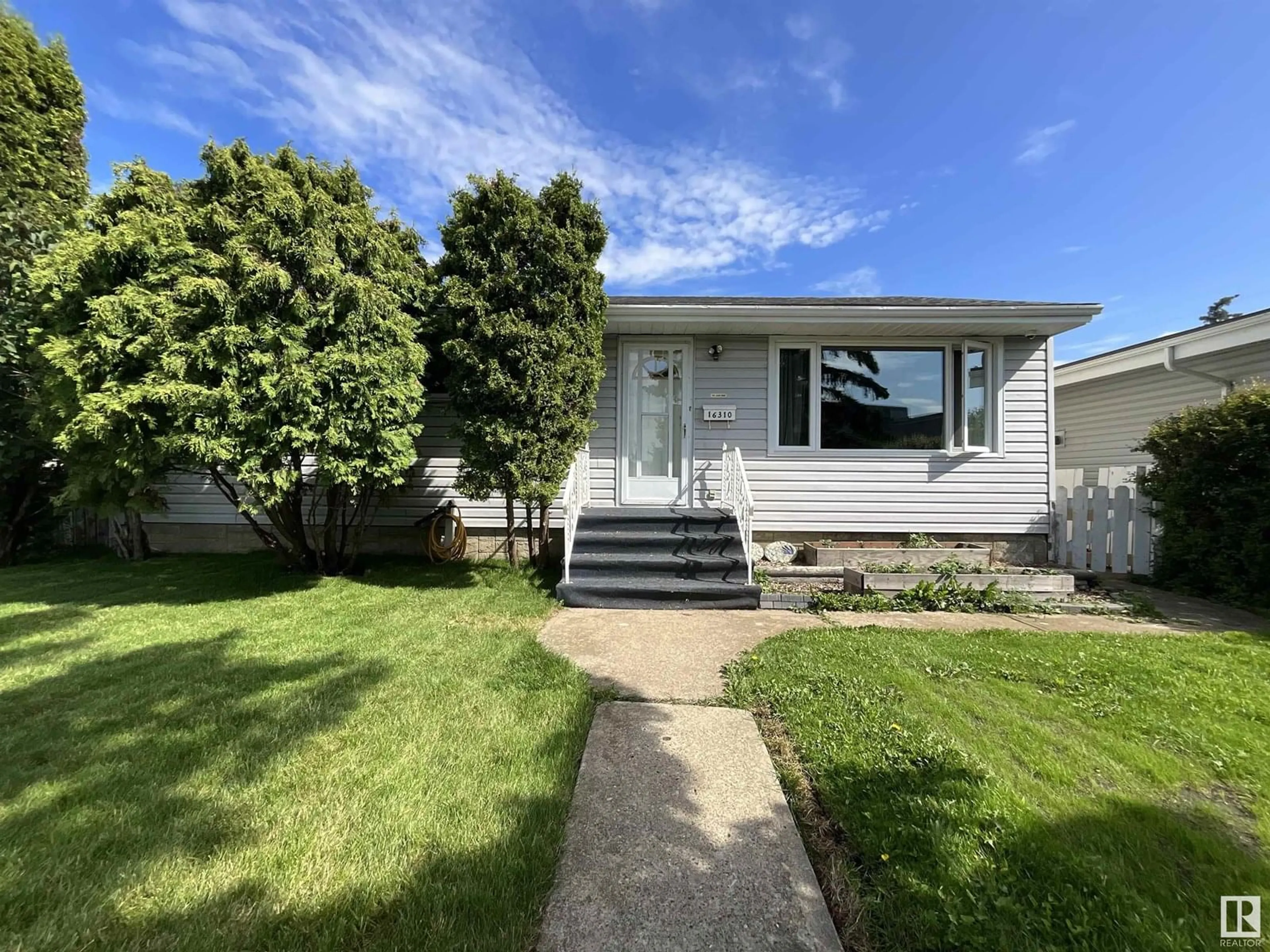 Home with vinyl exterior material, street for 16310 96A AV, Edmonton Alberta T5P0E5