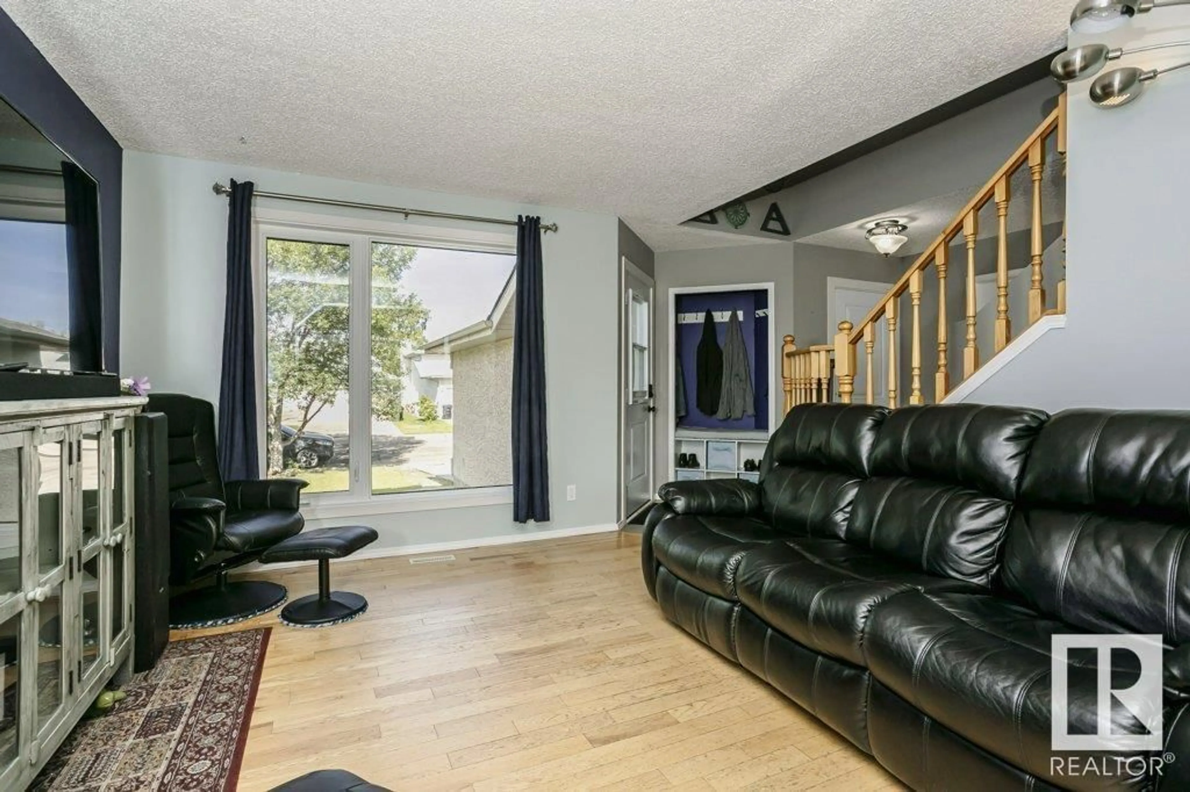 Living room with furniture, wood/laminate floor for 65 DALTON WY, Sherwood Park Alberta T8H1T6