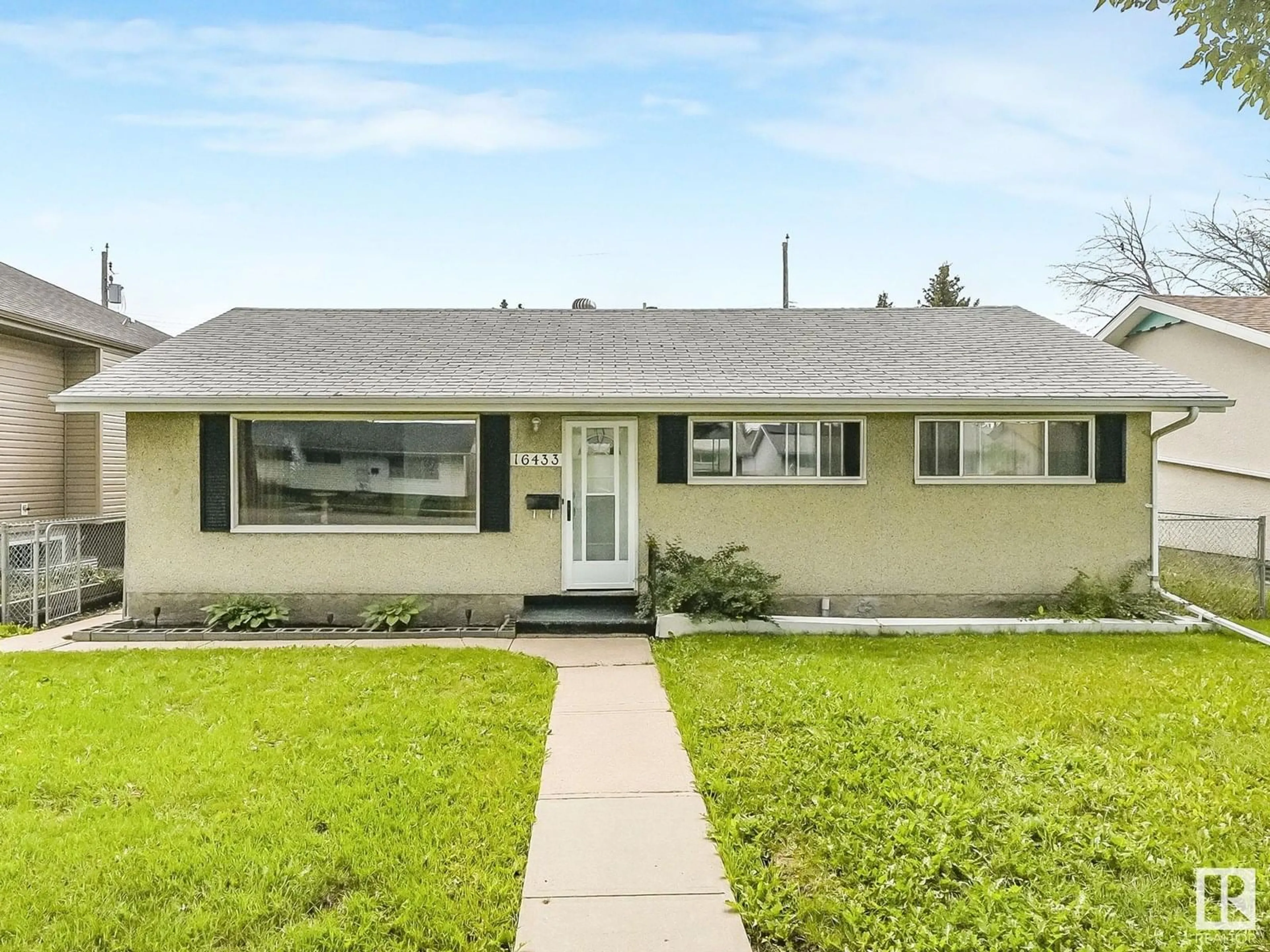 Home with vinyl exterior material, street for 16433 106 AV, Edmonton Alberta T5X0X1