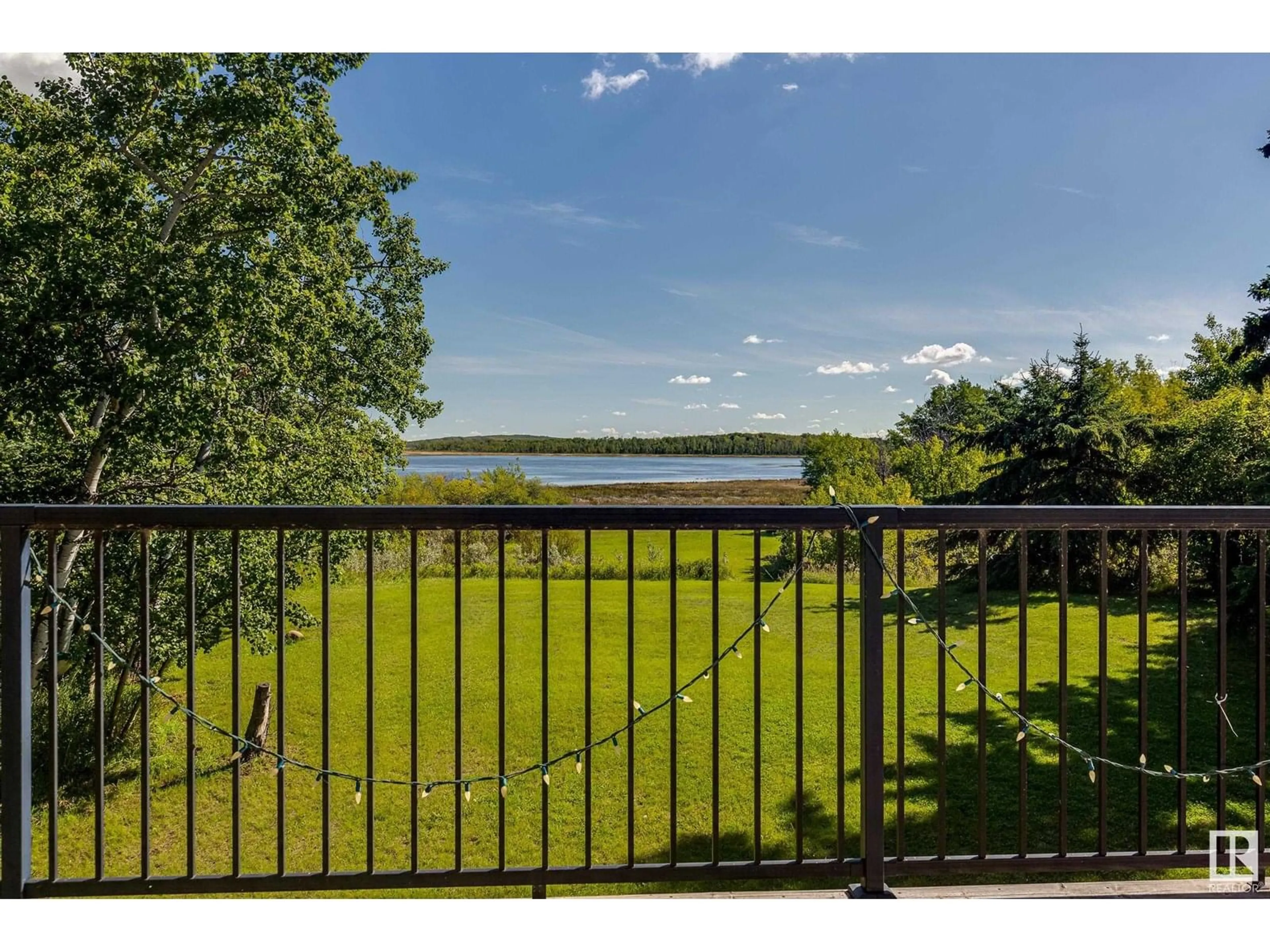 A pic from outside/outdoor area/front of a property/back of a property/a pic from drone, water/lake/river/ocean view for 602 PHEASANT CL, Rural Camrose County Alberta T0B0H0