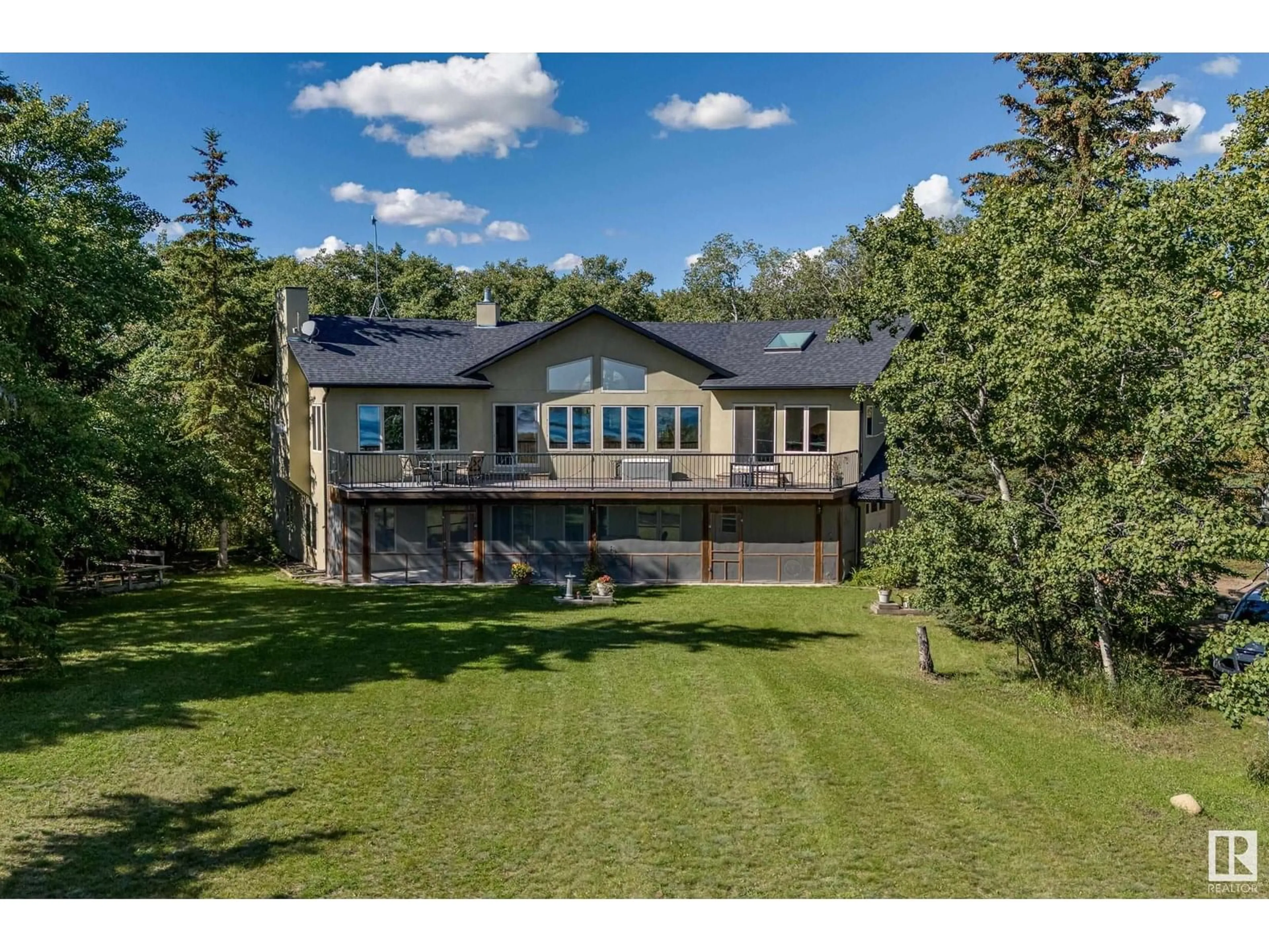 A pic from outside/outdoor area/front of a property/back of a property/a pic from drone, unknown for 602 PHEASANT CL, Rural Camrose County Alberta T0B0H0