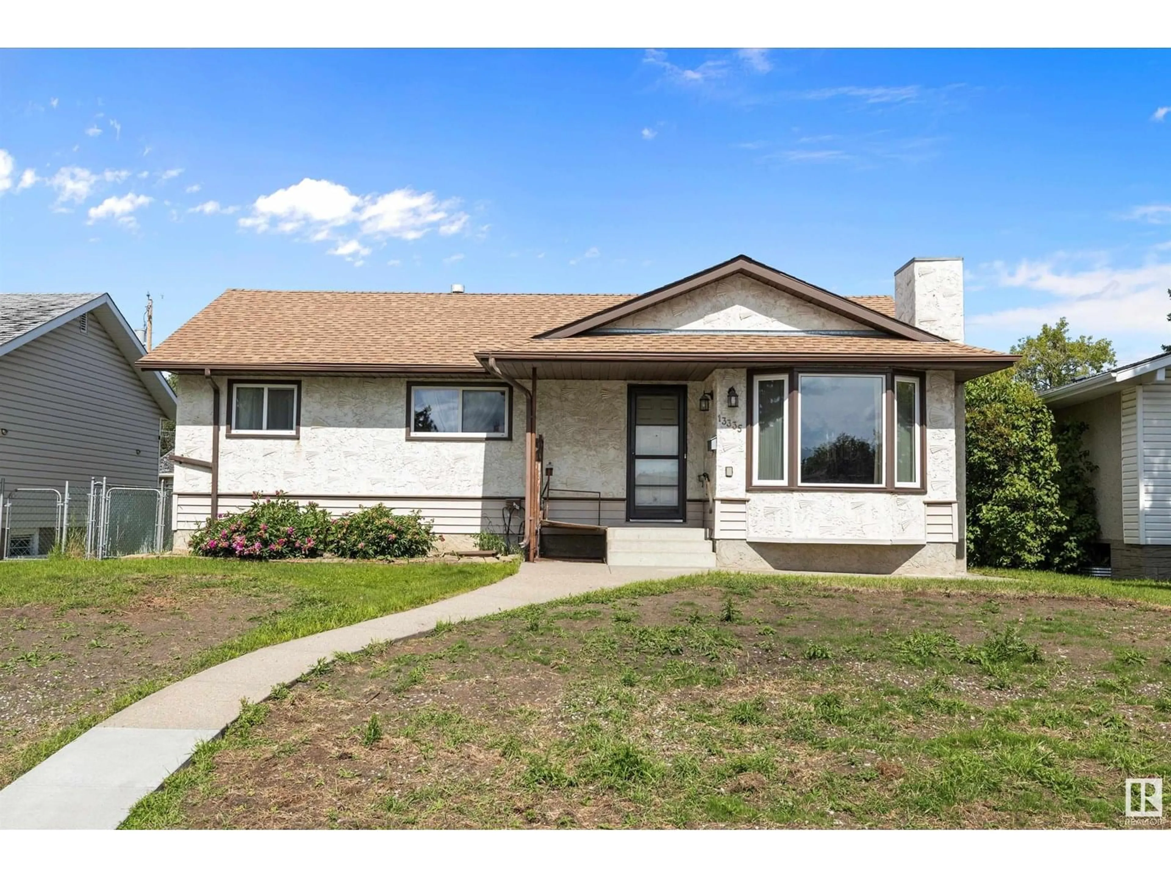 Home with vinyl exterior material, street for 13335 104 ST, Edmonton Alberta T5E4P2