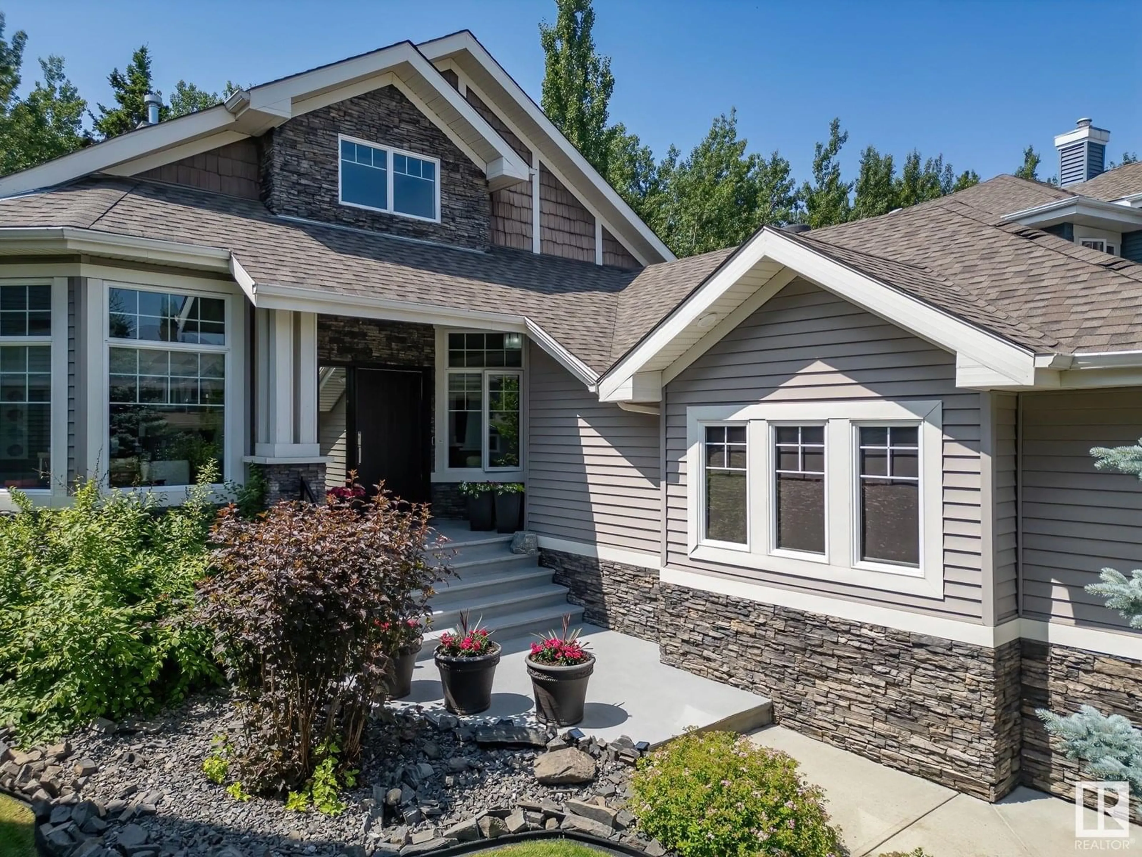 Home with vinyl exterior material, street for 4804 212 ST NW, Edmonton Alberta T6M0G2