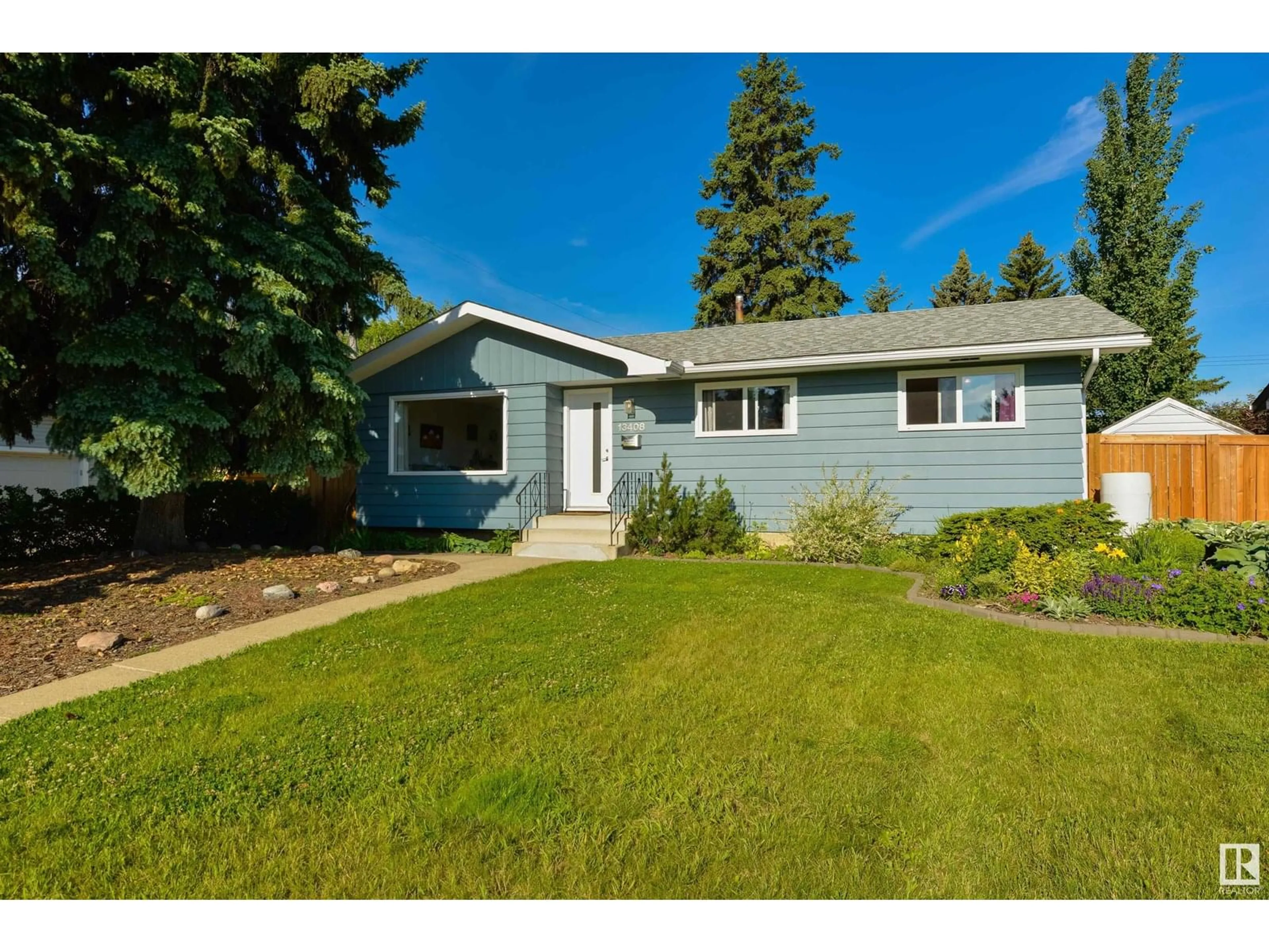 Home with vinyl exterior material, street for 13408 116 ST, Edmonton Alberta T5E5J1