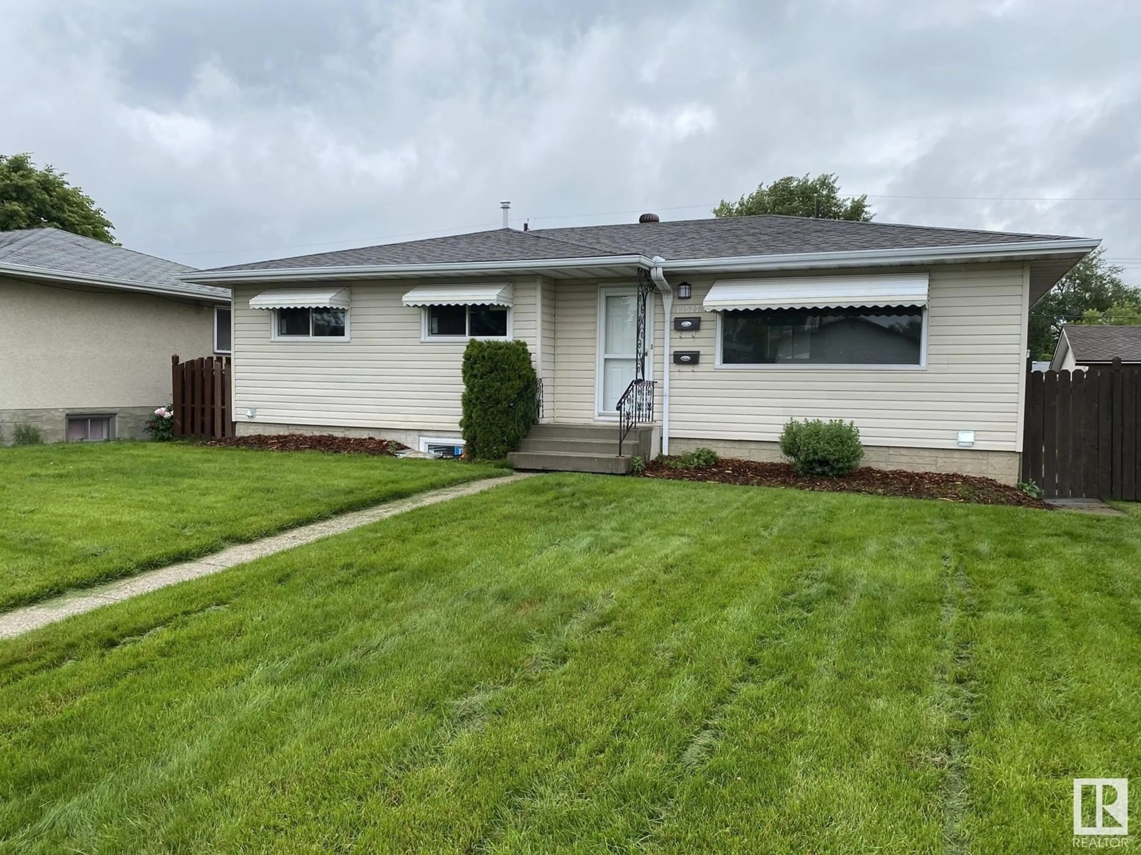 Home with vinyl exterior material, street for 13527 70 ST, Edmonton Alberta T5C0K5