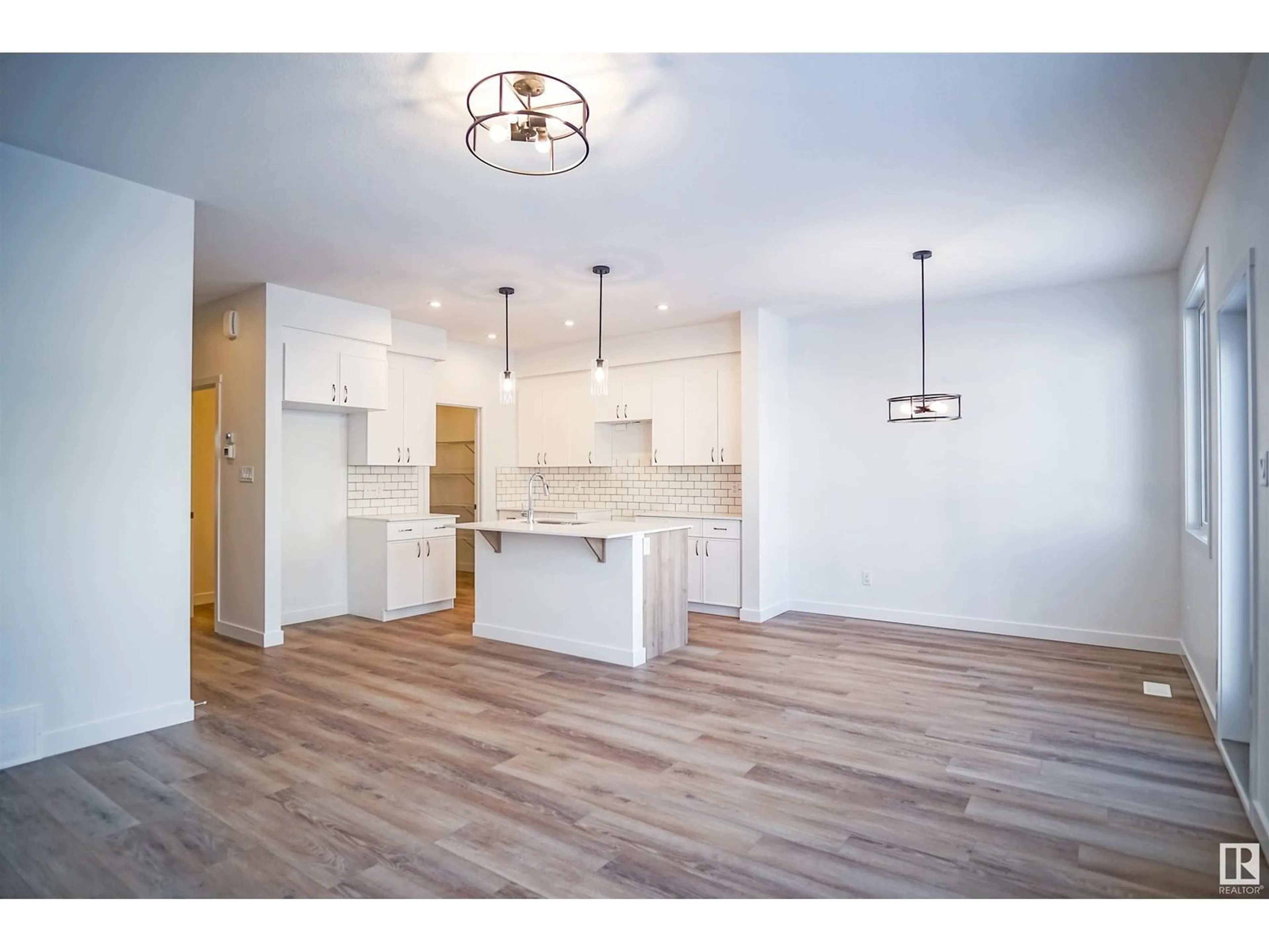 Open concept kitchen, wood/laminate floor for 9720 CARSON PL, Edmonton Alberta T6W5P9