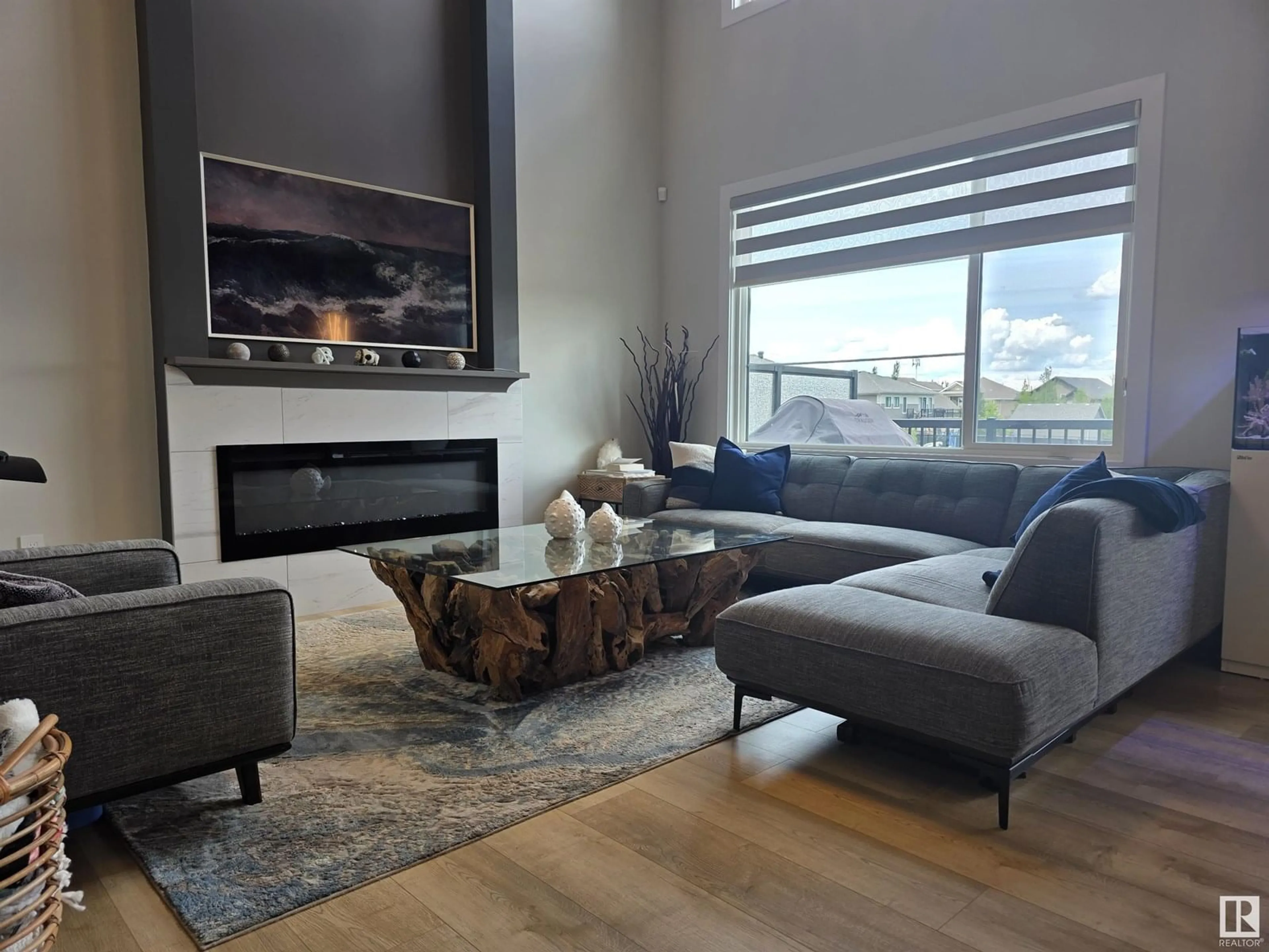 Living room with furniture, wood/laminate floor for 570 MEADOWVIEW DR, Fort Saskatchewan Alberta T8L0X1