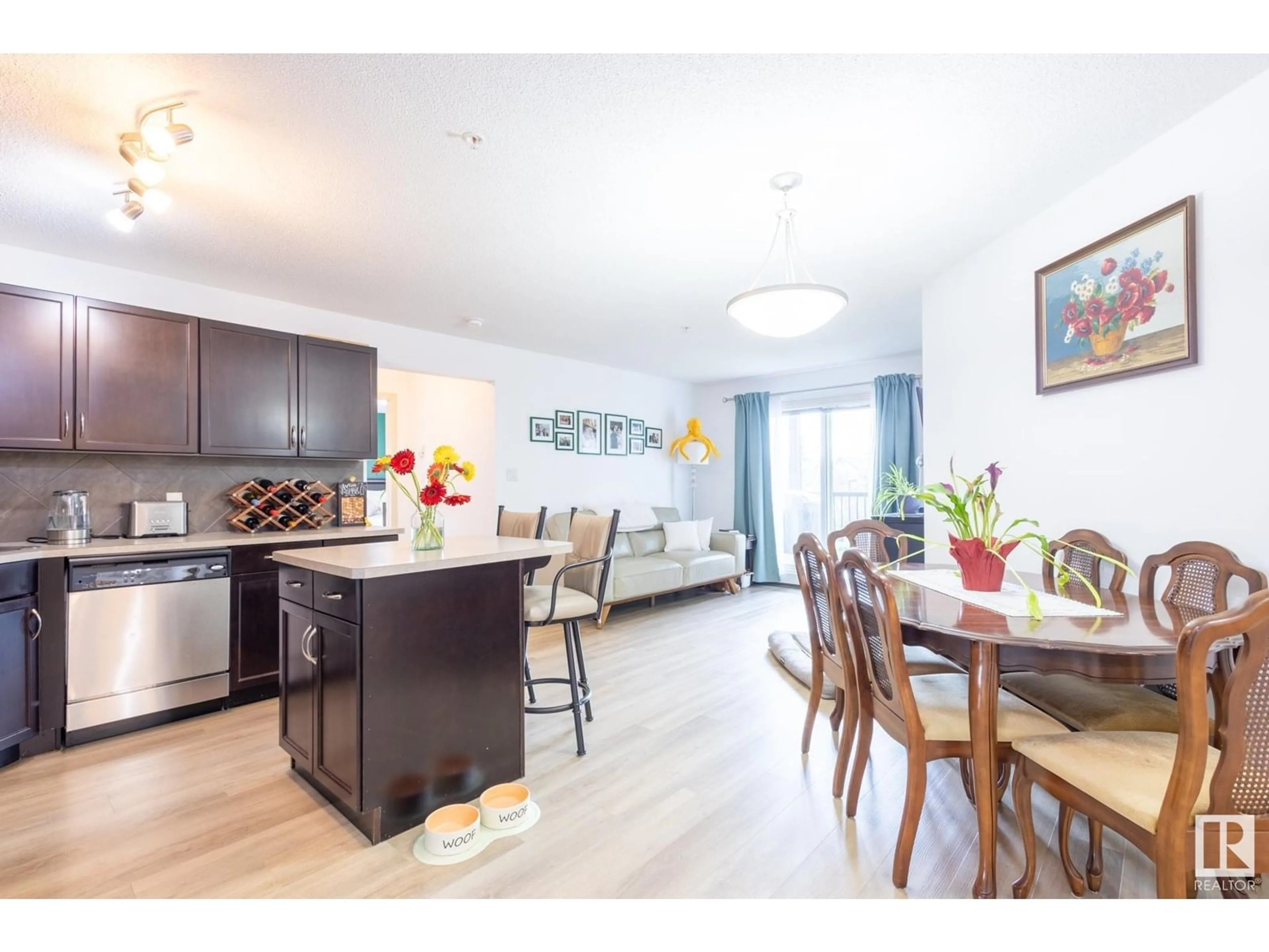 Open concept kitchen, wood/laminate floor for 312 - 5951 165 AV, Edmonton Alberta T5Y0J6