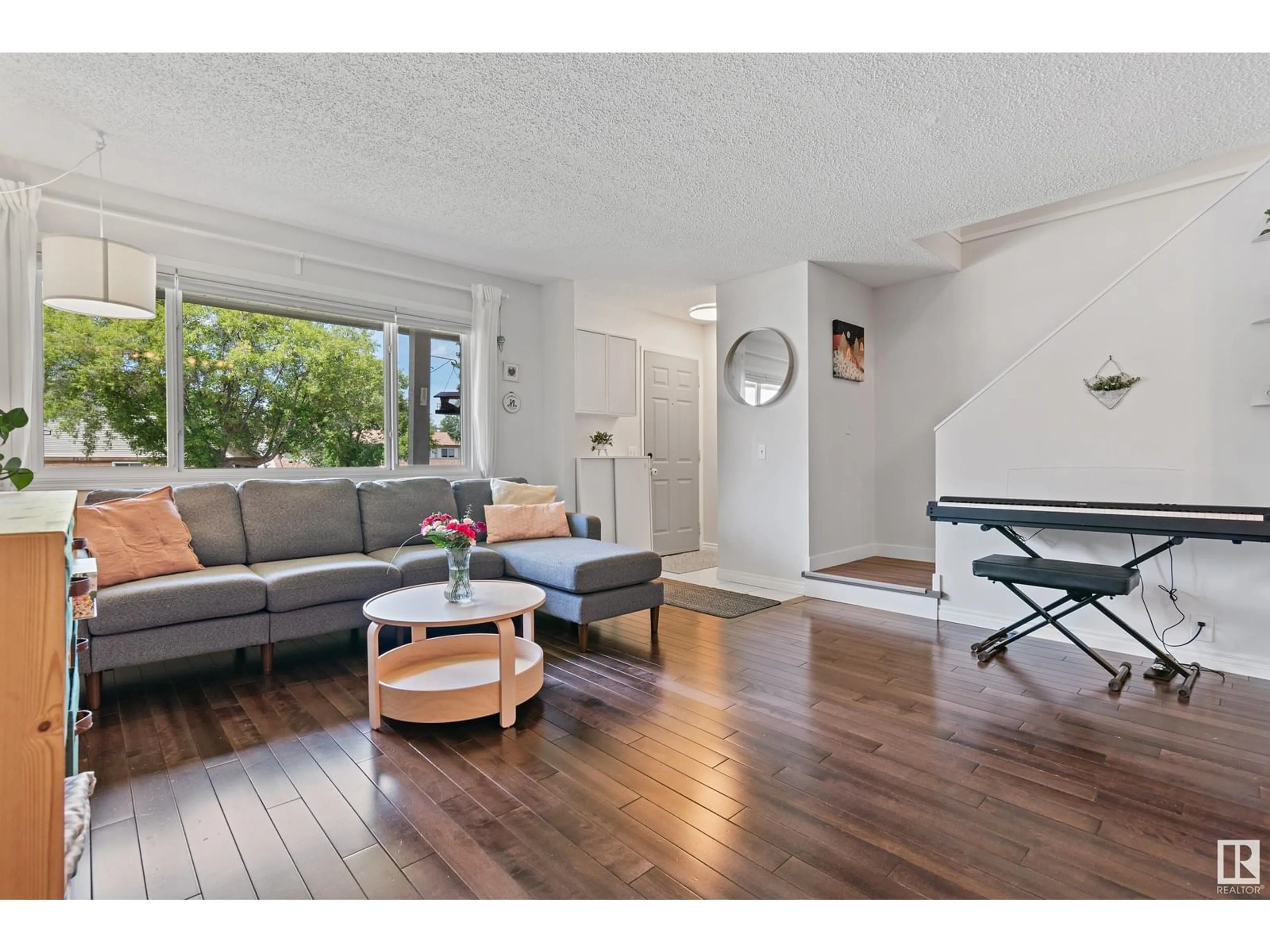 Living room with furniture, wood/laminate floor for 35 WALDEN PA, St. Albert Alberta T8N3V6