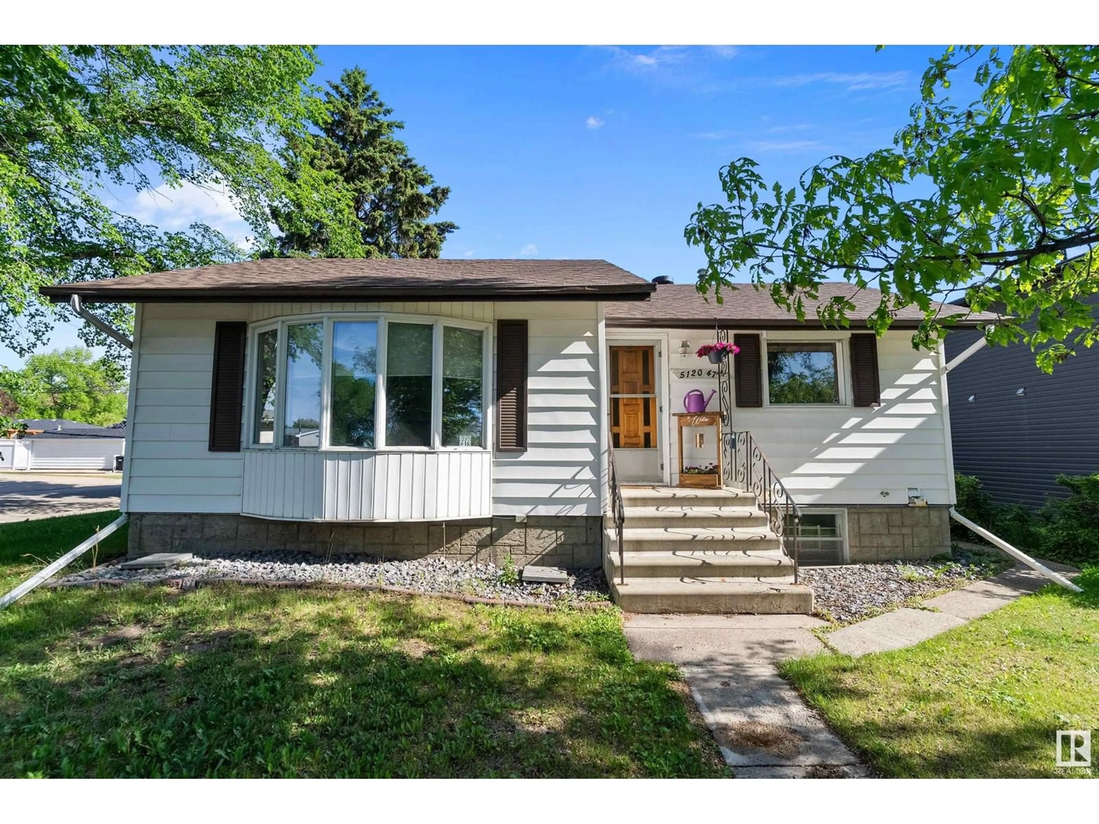 Home with vinyl exterior material, street for 5120 47 AV, Leduc Alberta T9E5C5
