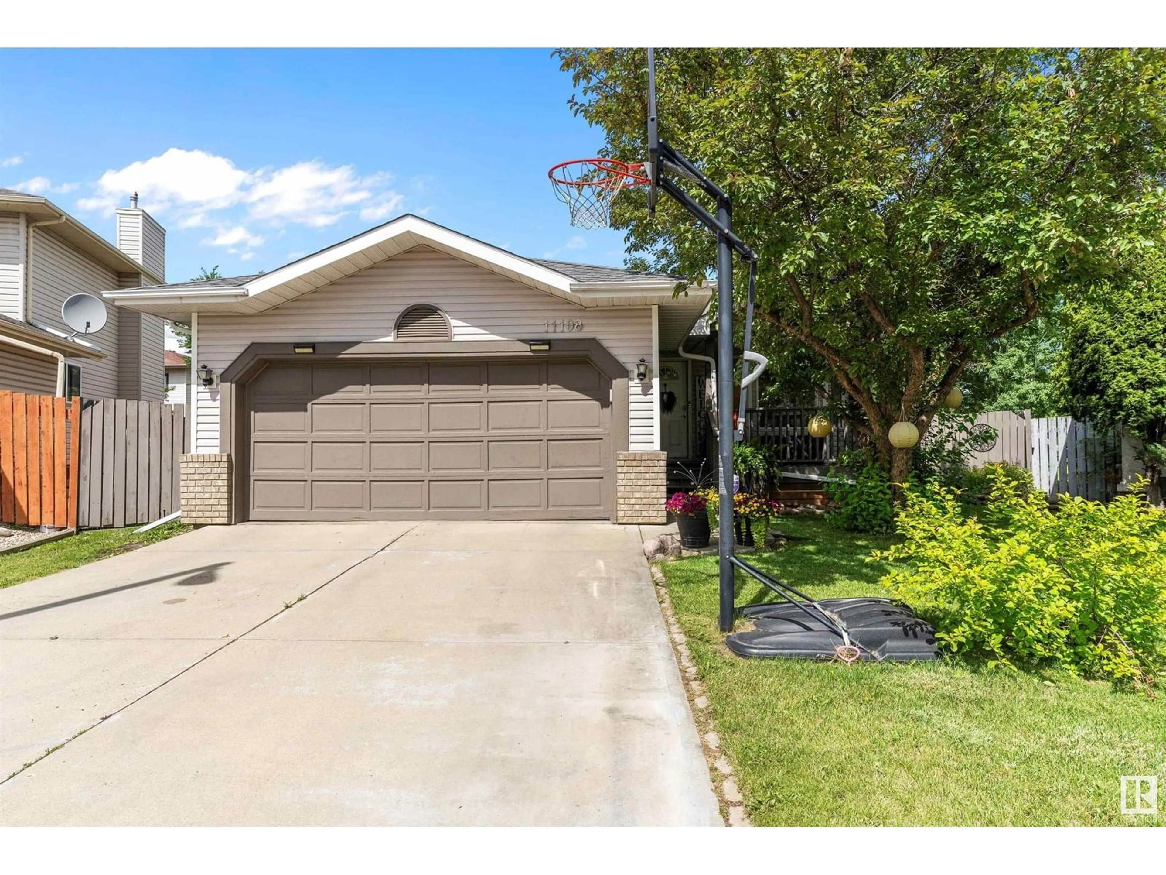 Home with vinyl exterior material, street for 11108 10A AV, Edmonton Alberta T6J6S8