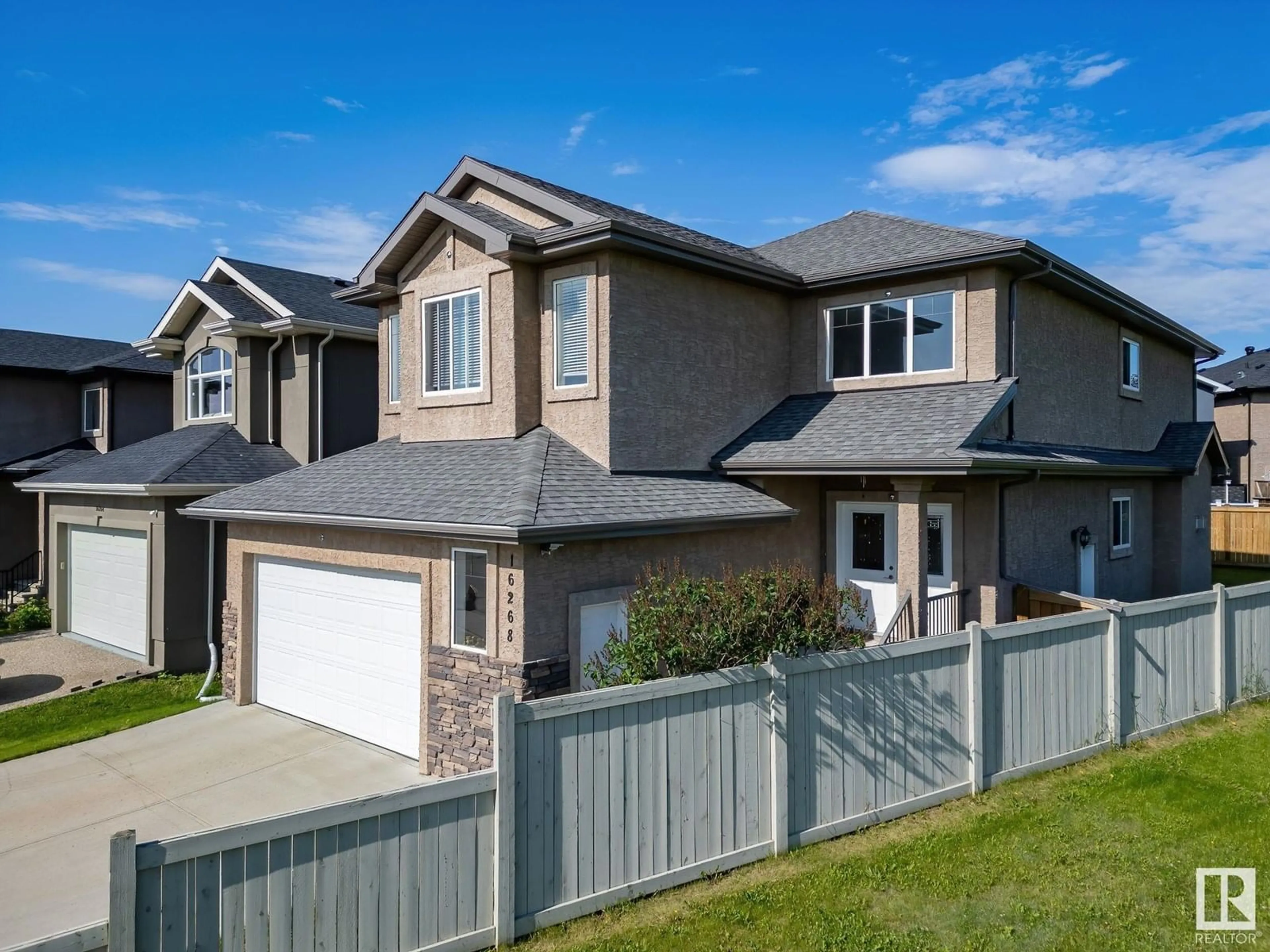 Home with vinyl exterior material, street for 16268 137 ST, Edmonton Alberta T6V0J7