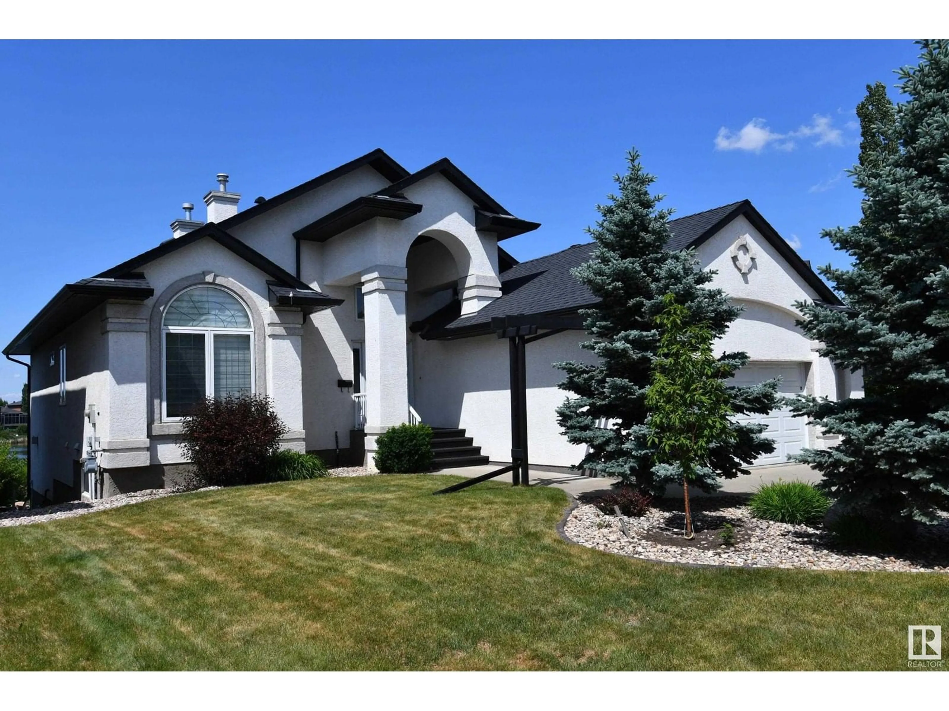 Home with vinyl exterior material, street for 46 SHORES DR, Leduc Alberta T9E8N7