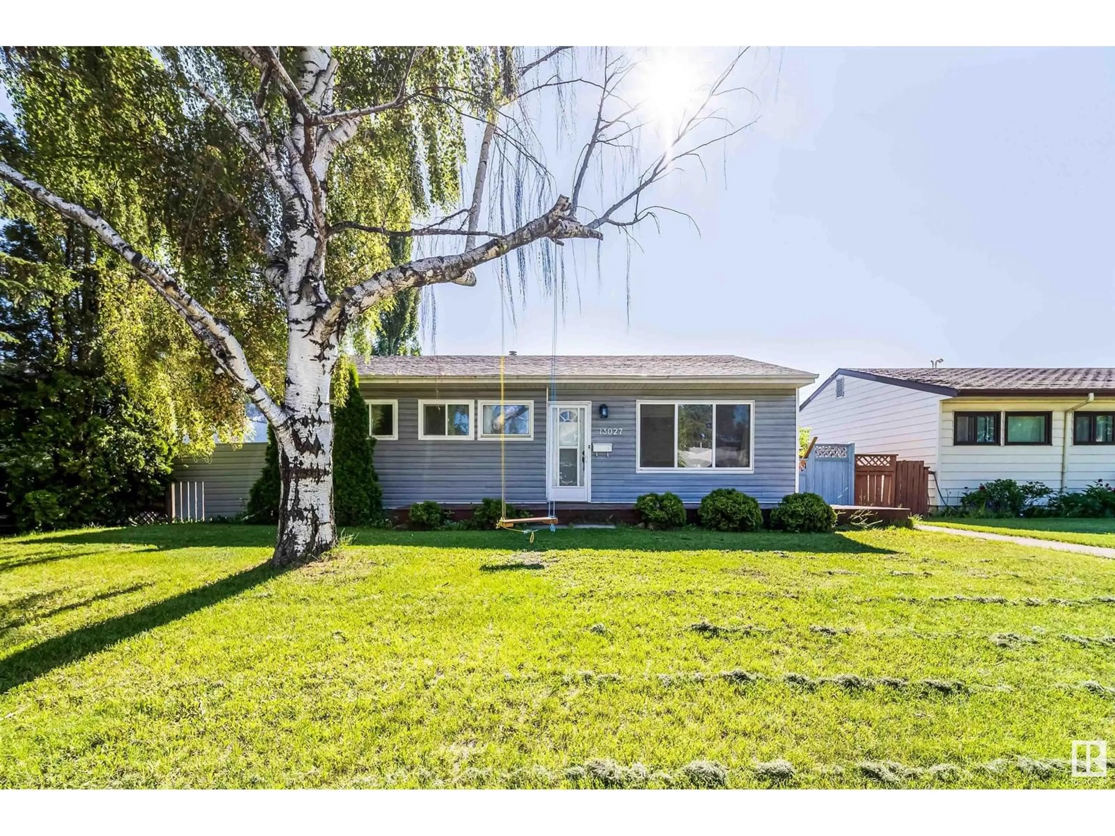 Home with vinyl exterior material, street for 13027 125 ST NW, Edmonton Alberta T5L0V5