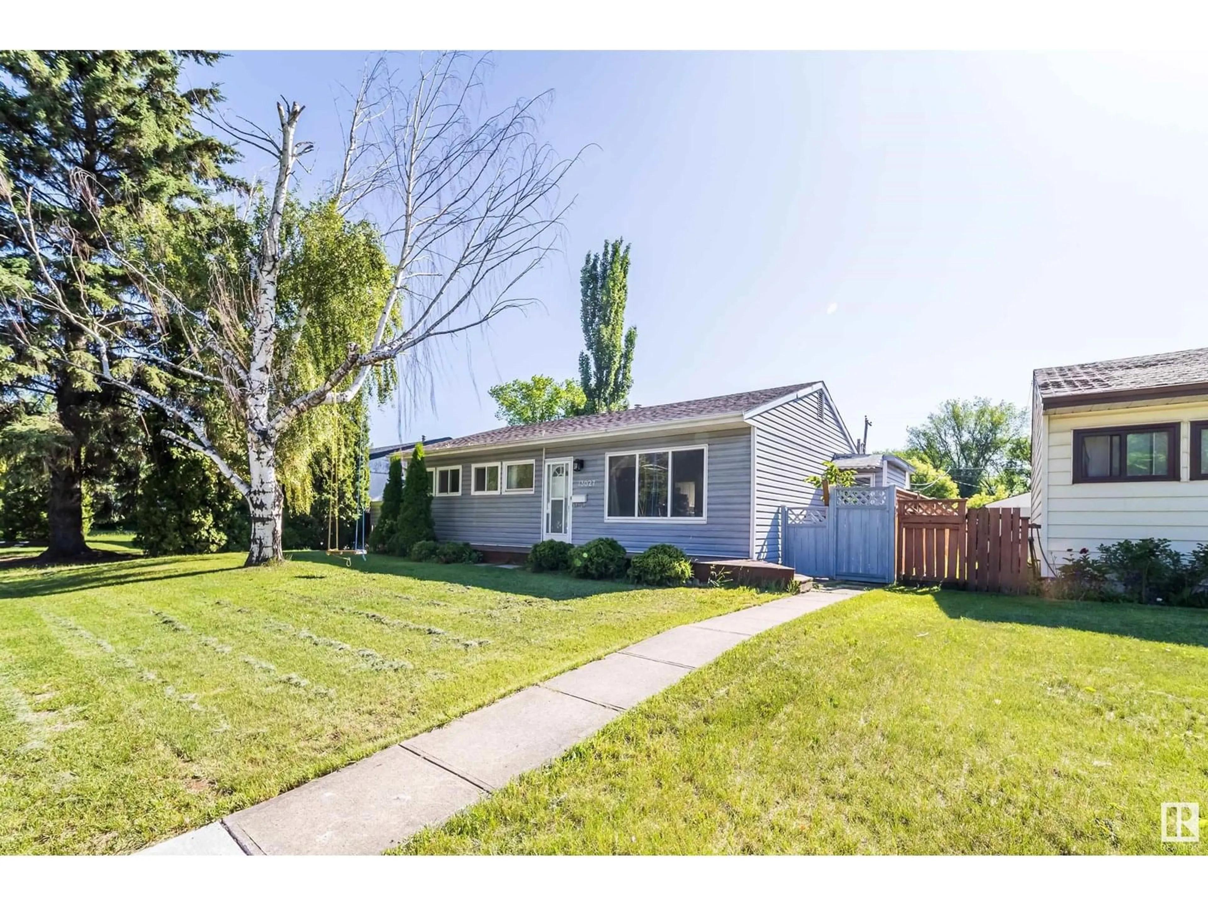 Home with vinyl exterior material, street for 13027 125 ST NW, Edmonton Alberta T5L0V5