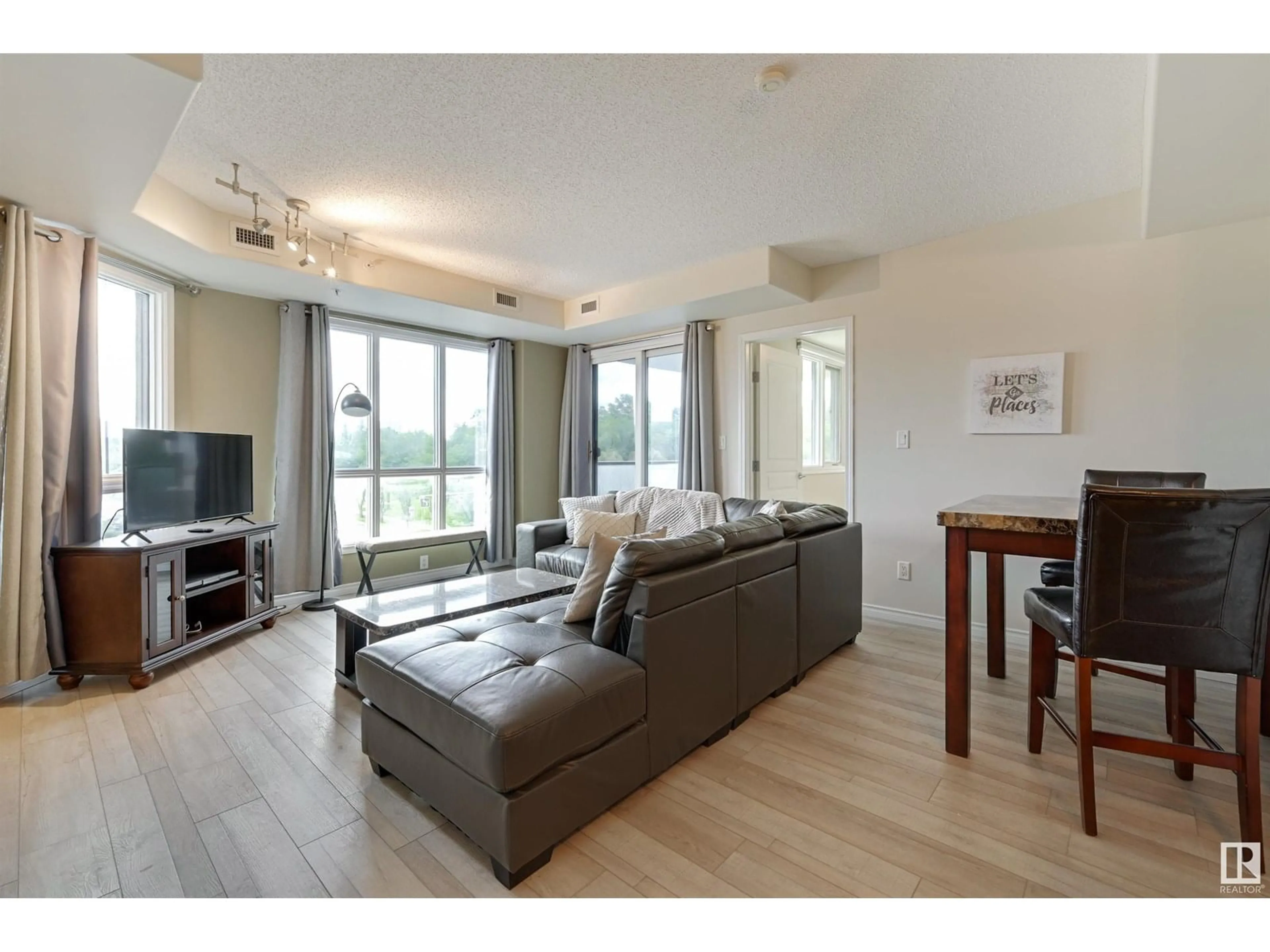 Living room with furniture, wood/laminate floor for #302 - 9707 106 ST, Edmonton Alberta T5K0B7