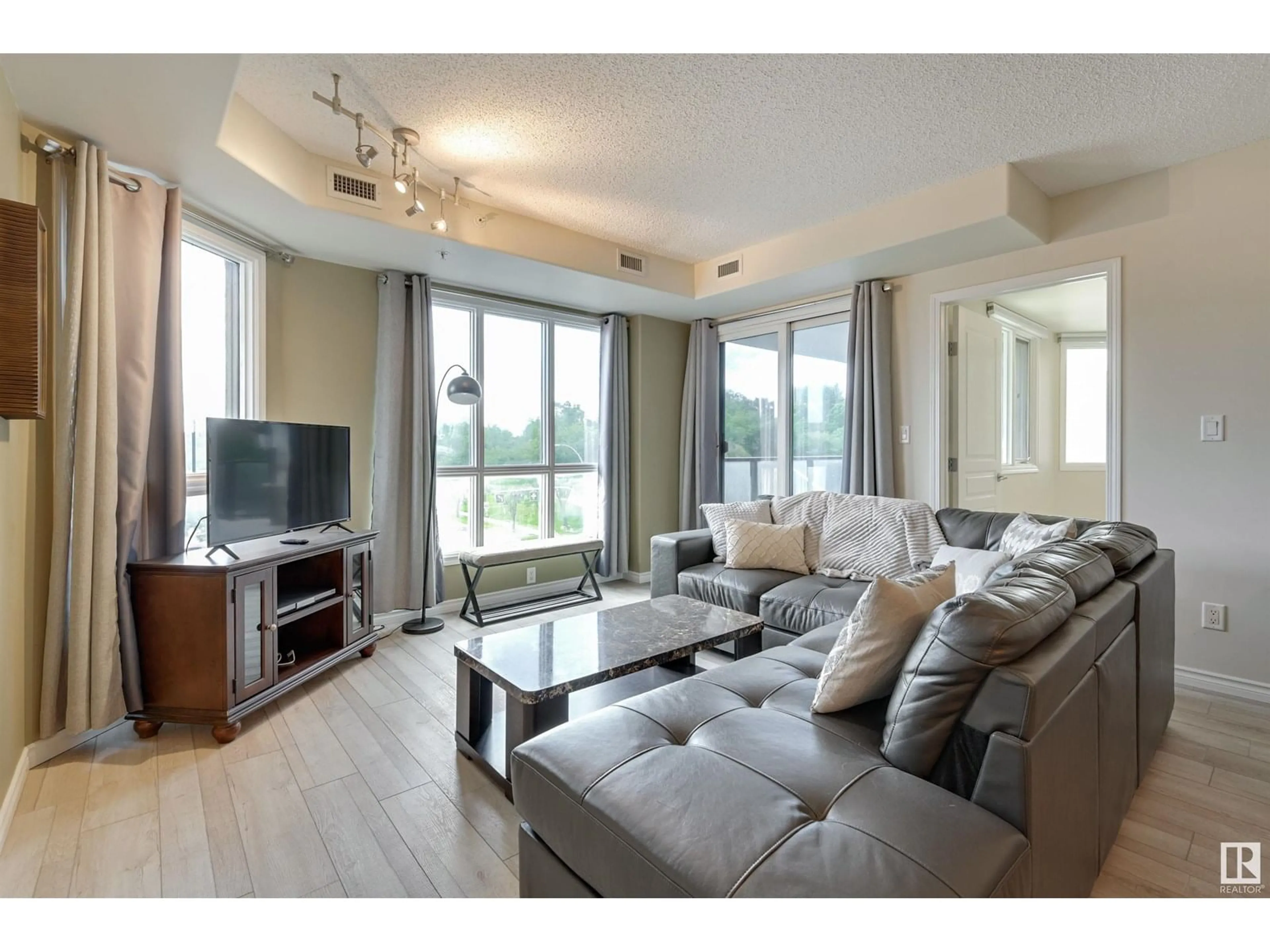 Living room with furniture, wood/laminate floor for #302 - 9707 106 ST, Edmonton Alberta T5K0B7