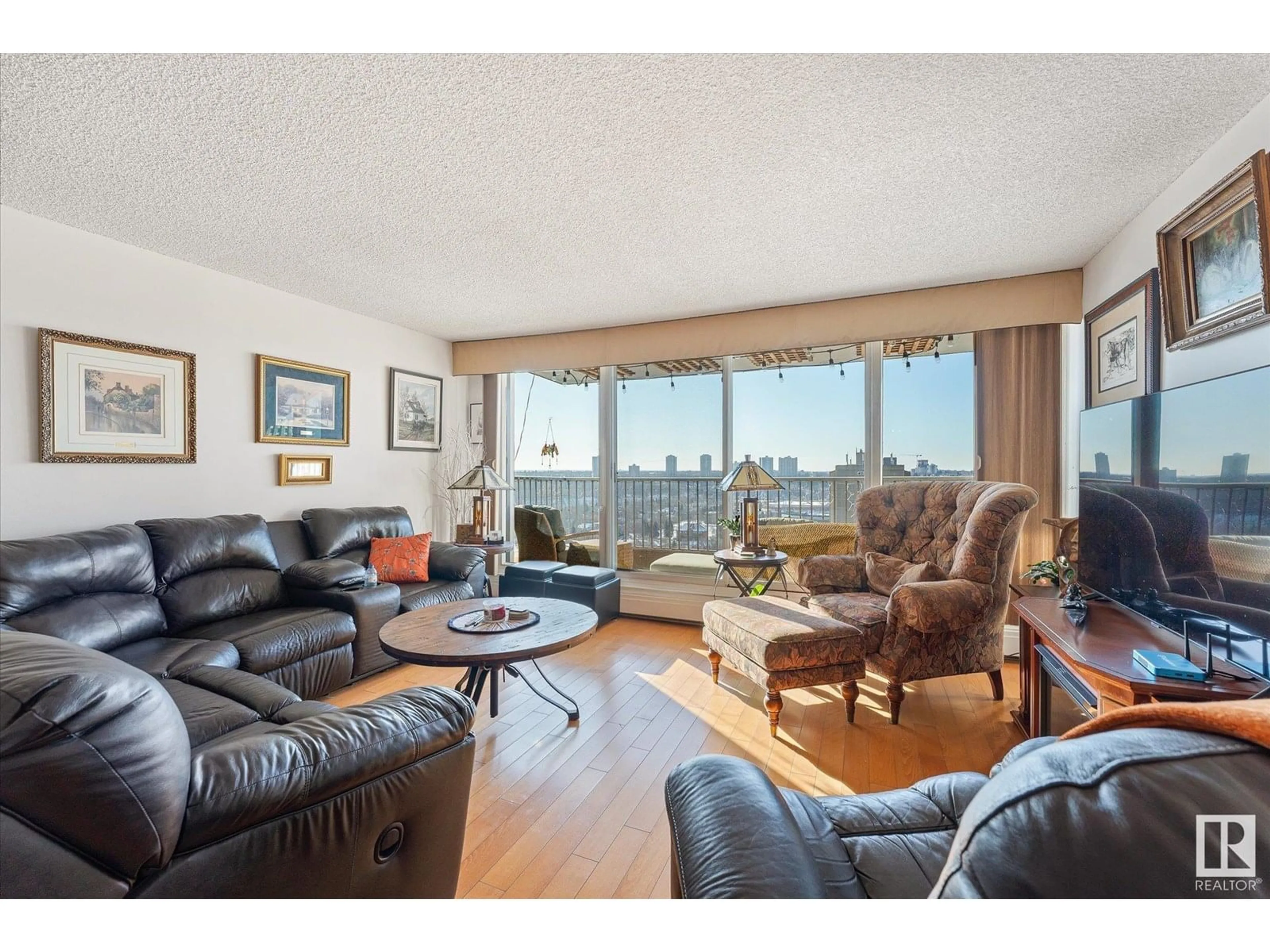 Living room with furniture, wood/laminate floor for #1002 - 9923 103 ST, Edmonton Alberta T5K2J3