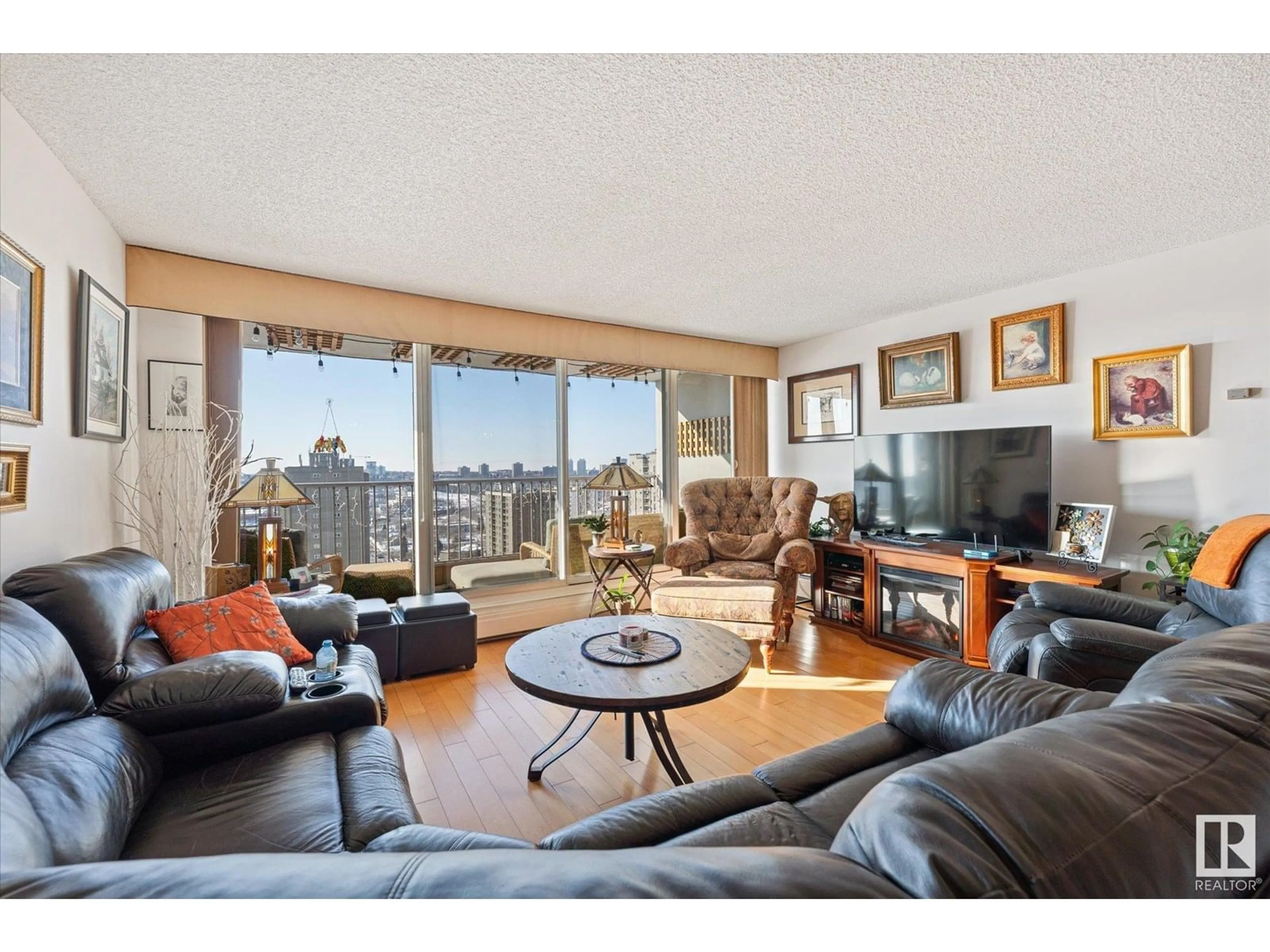 Living room with furniture, wood/laminate floor for #1002 - 9923 103 ST, Edmonton Alberta T5K2J3