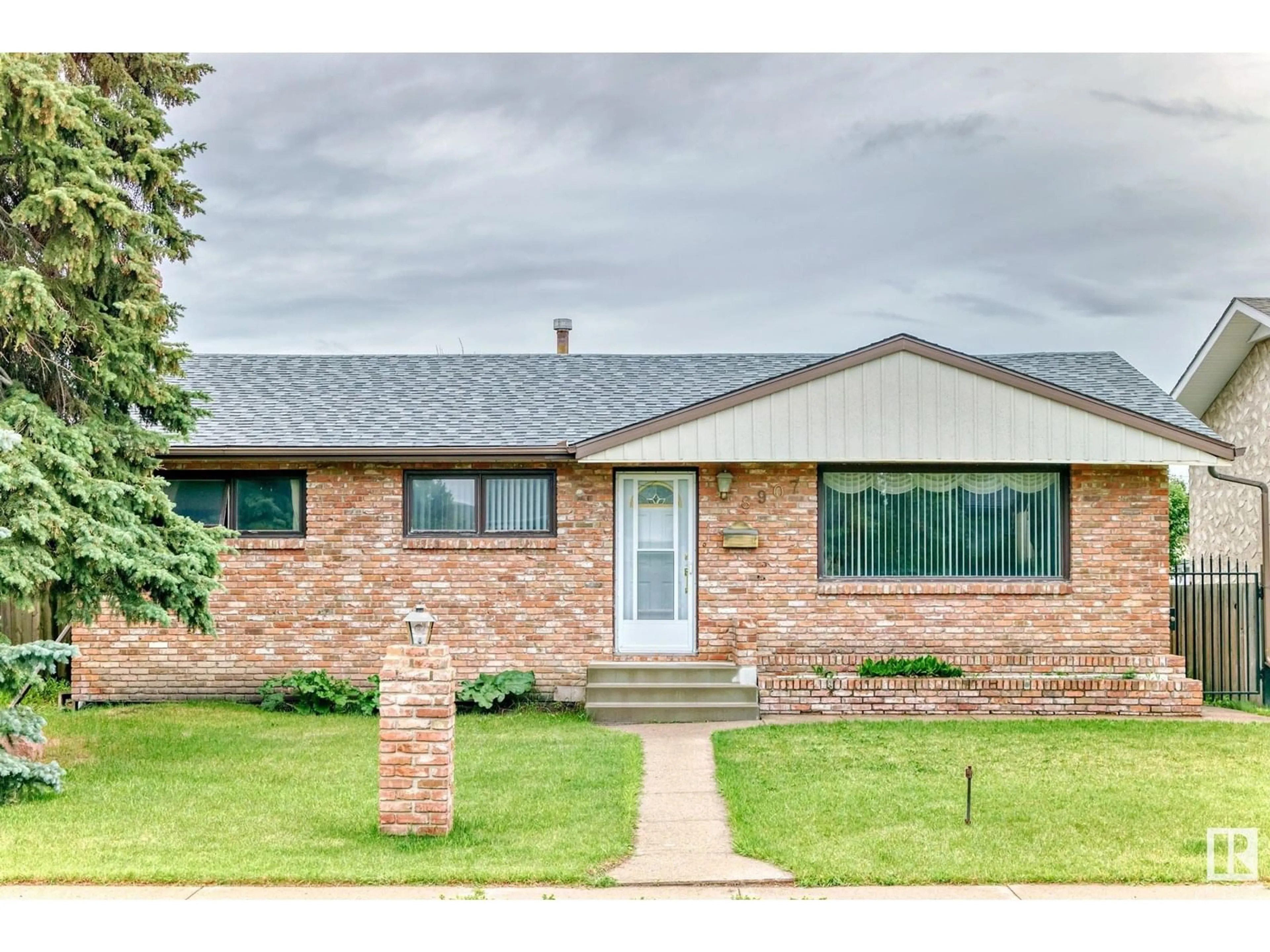 Home with brick exterior material, street for 8907 138 AV, Edmonton Alberta T5E2A7