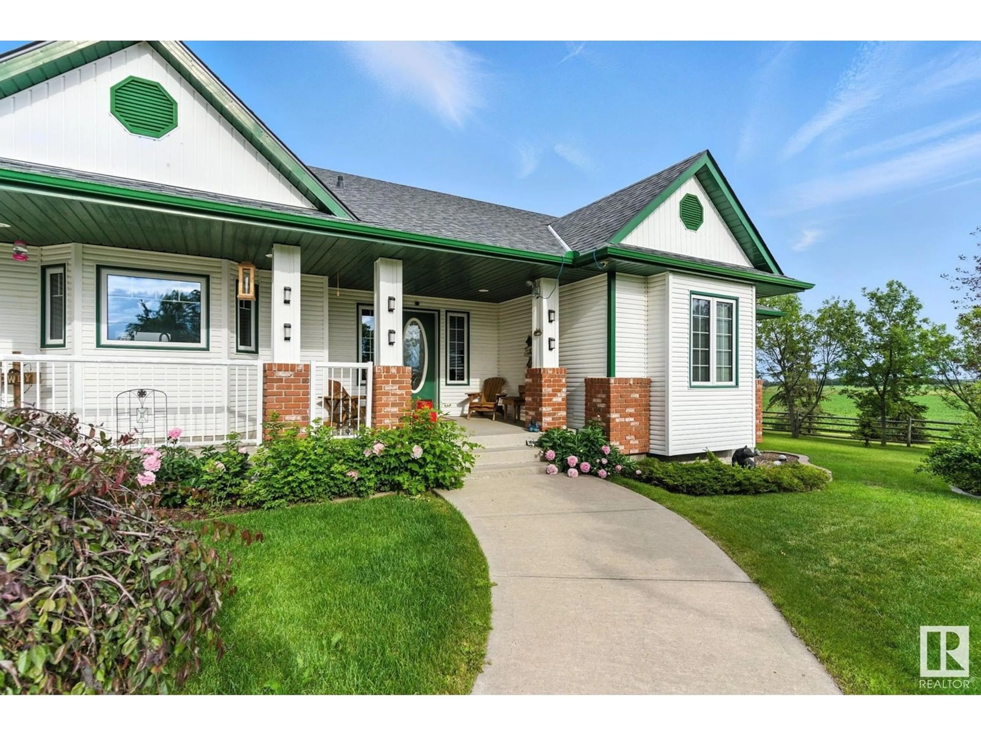 Home with vinyl exterior material, street for 49317 RGE ROAD 245, Rural Leduc County Alberta T4X2P8