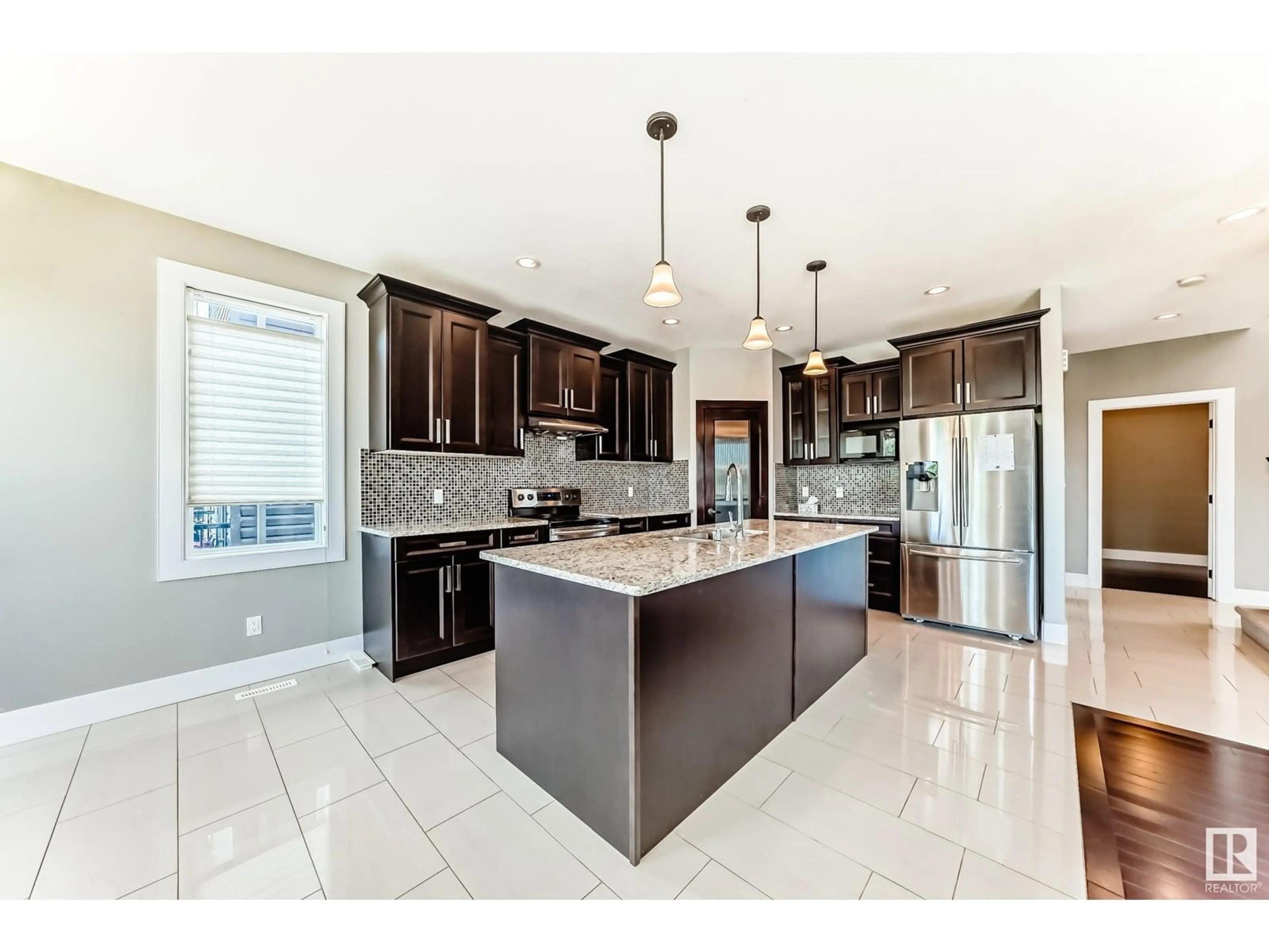 Open concept kitchen, ceramic/tile floor for 14062 161A AV, Edmonton Alberta T6V0J3