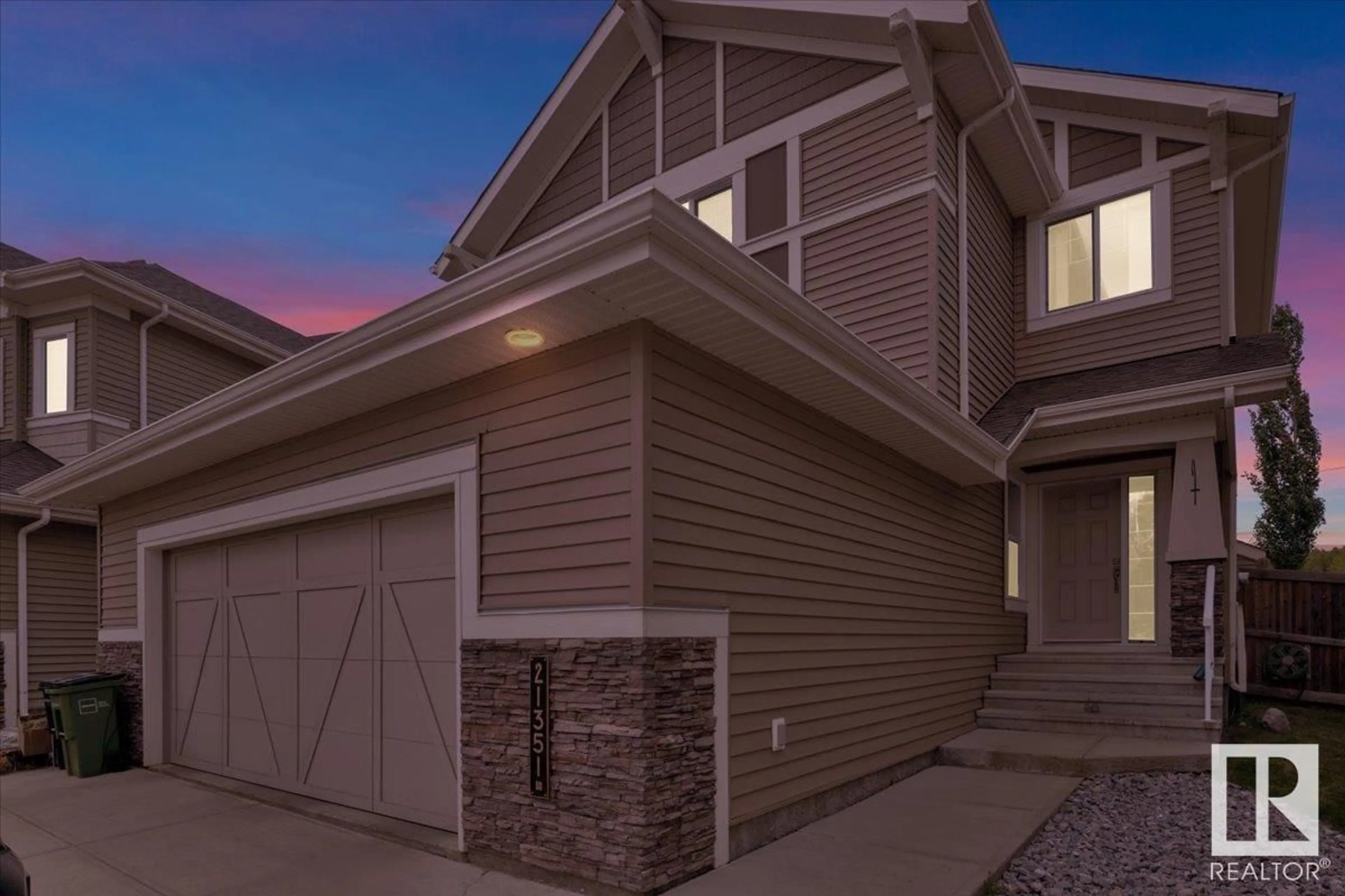Home with vinyl exterior material, street for NW - 21351 51 AV, Edmonton Alberta T6M0K7