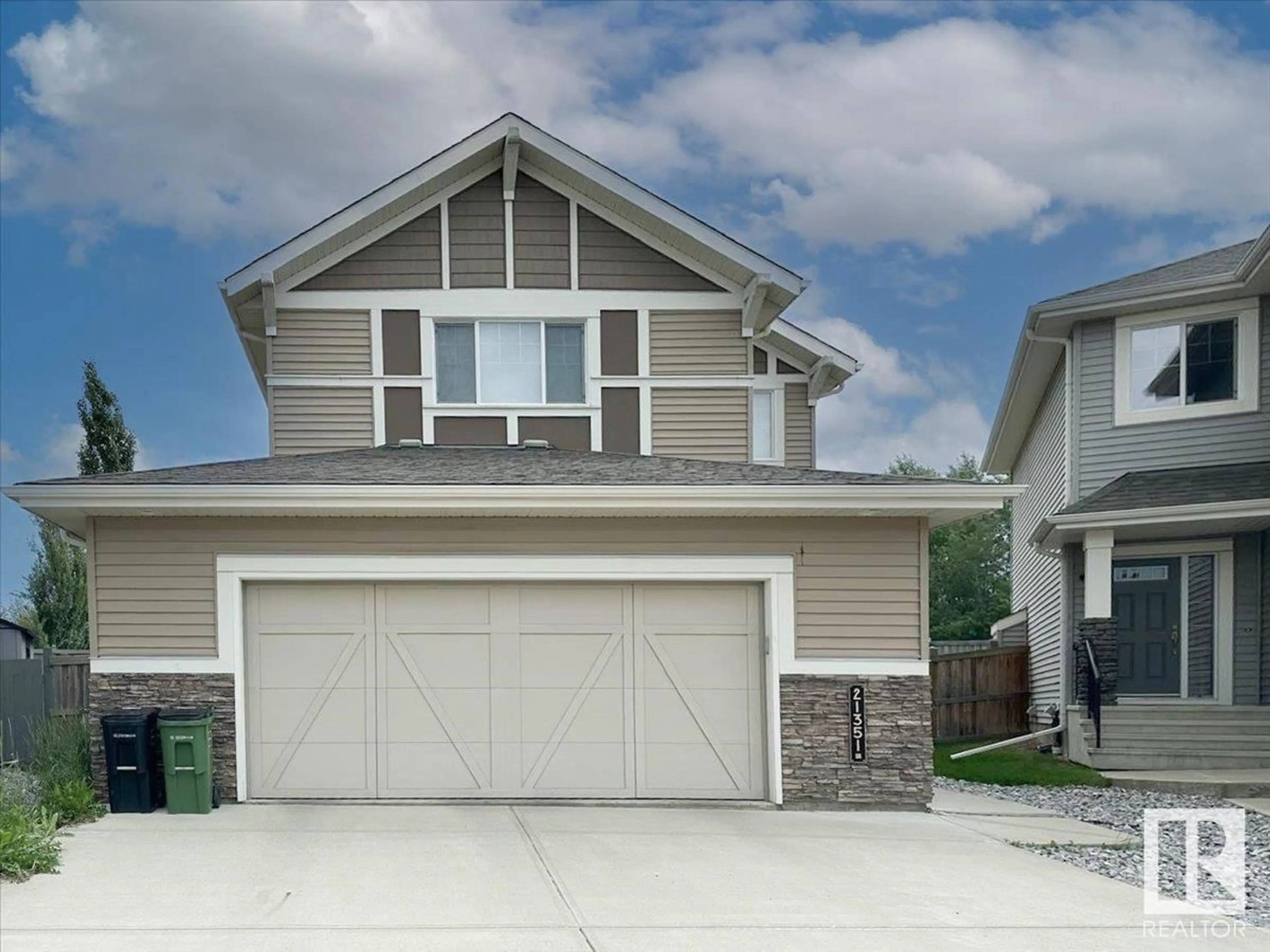 Home with vinyl exterior material, street for NW - 21351 51 AV, Edmonton Alberta T6M0K7