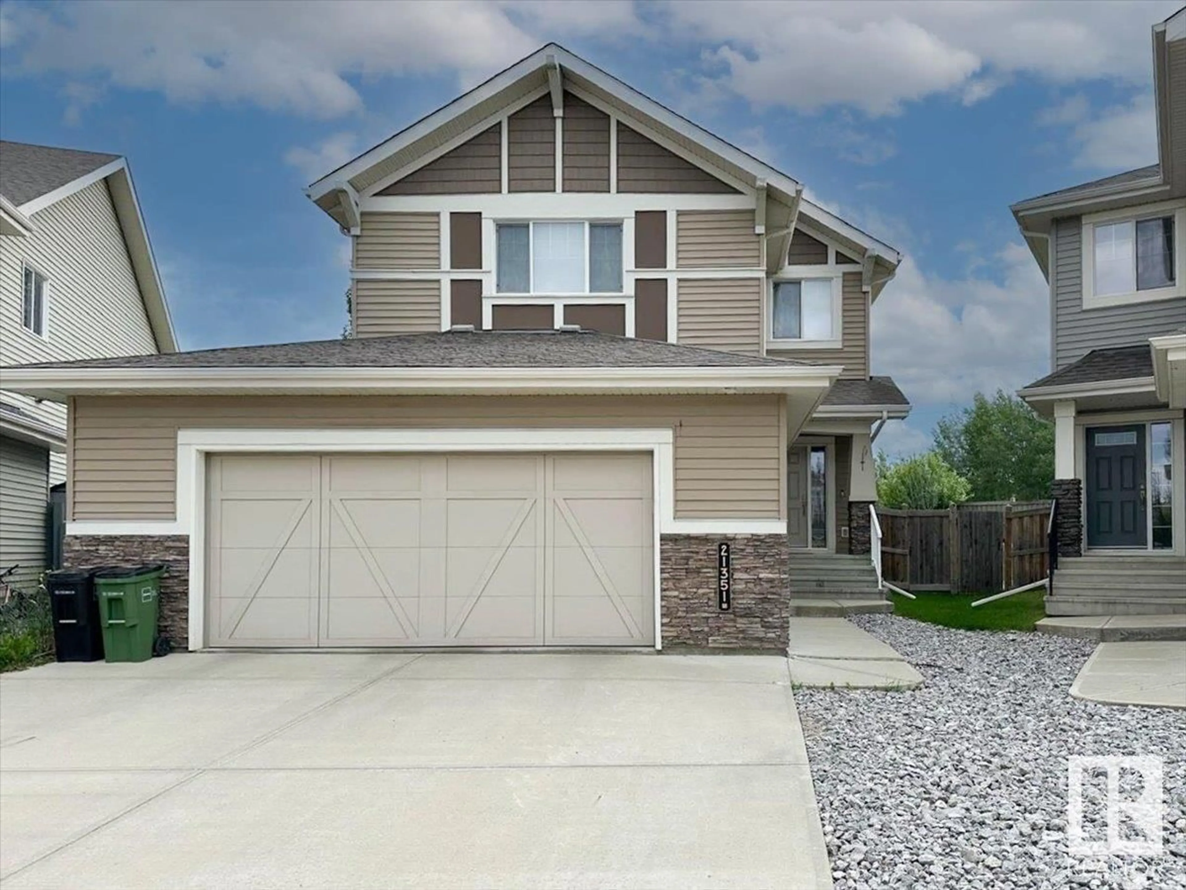 Home with vinyl exterior material, street for NW - 21351 51 AV, Edmonton Alberta T6M0K7