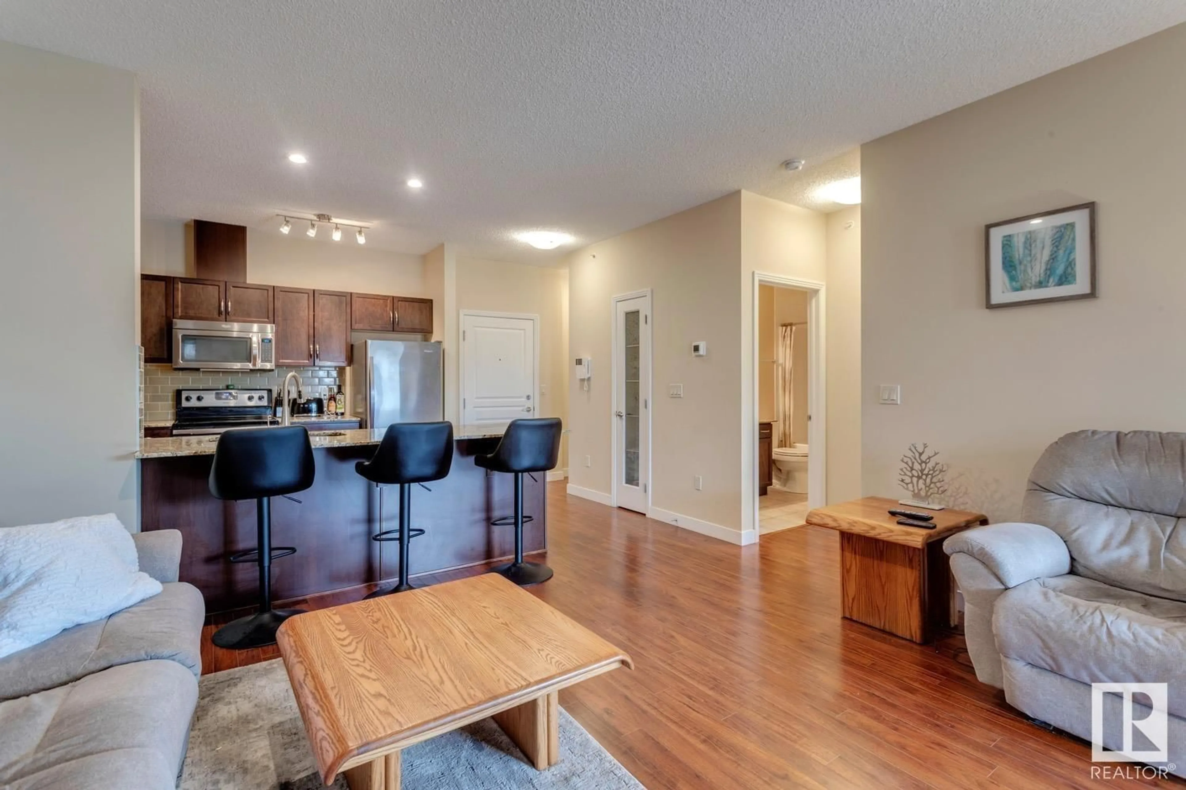 Open concept kitchen, wood/laminate floor for #426 - 2045 GRANTHAM CO, Edmonton Alberta T5T3X6