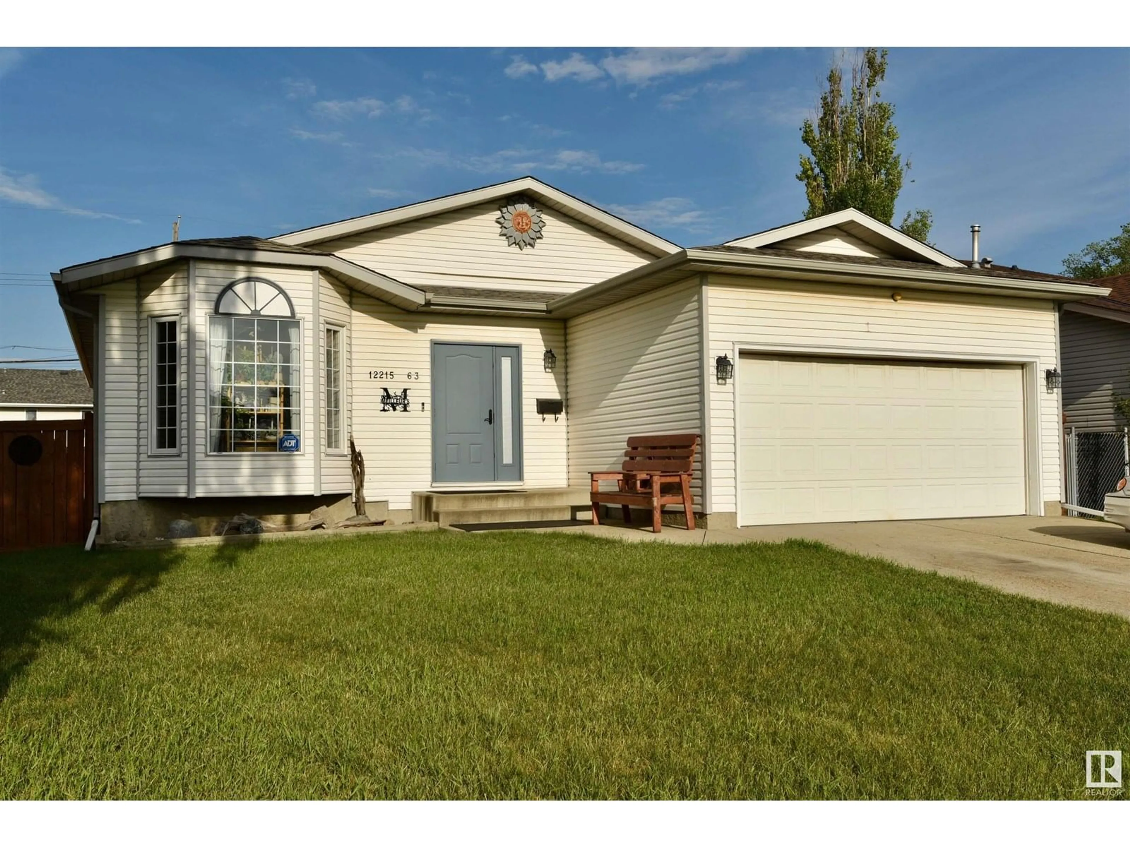 Home with vinyl exterior material, street for 12215 63 ST, Edmonton Alberta T5W5G7