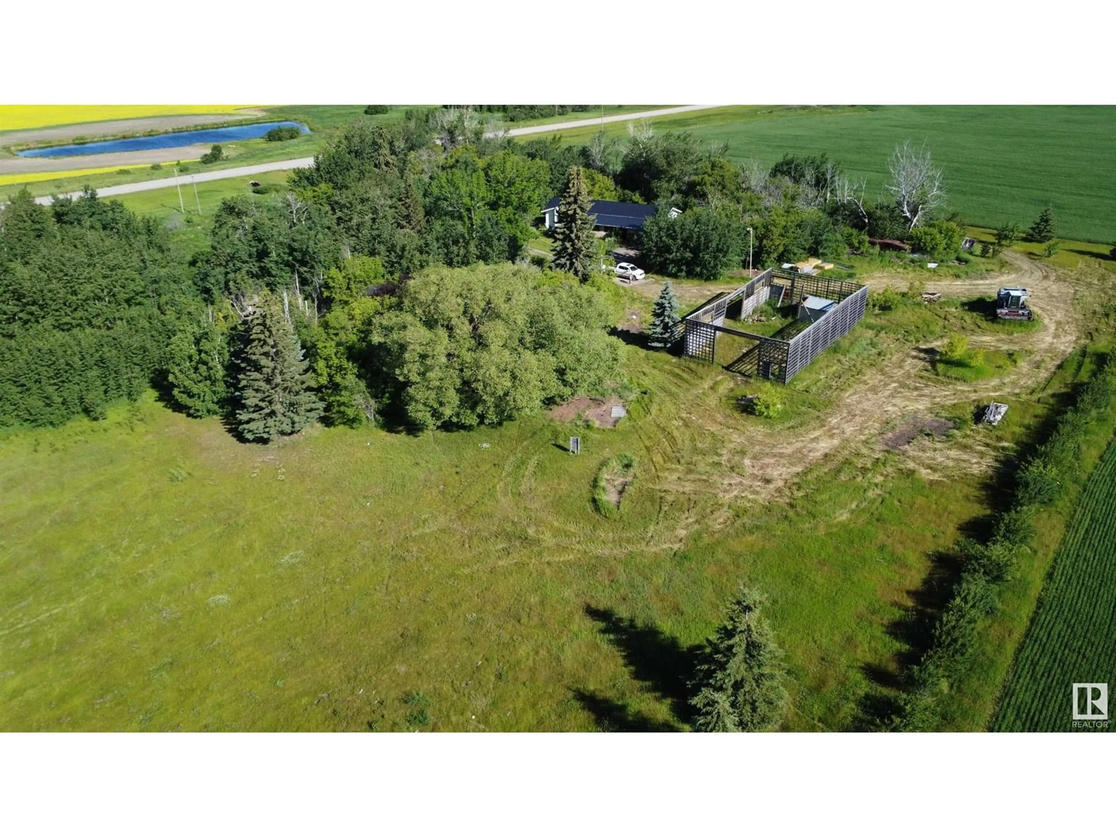 A pic from outside/outdoor area/front of a property/back of a property/a pic from drone, unknown for 59211 HWY 2, Rural Westlock County Alberta T0G0P0