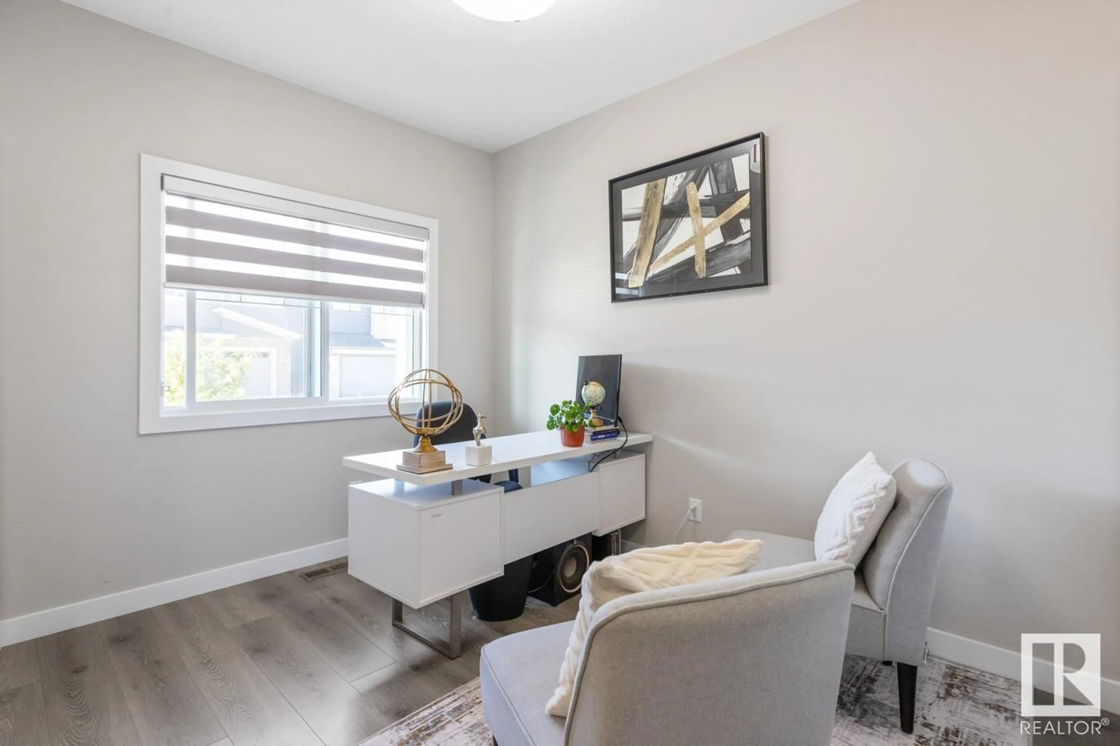 Living room with furniture, wood/laminate floor for 19636 26 AV, Edmonton Alberta T6M0X4