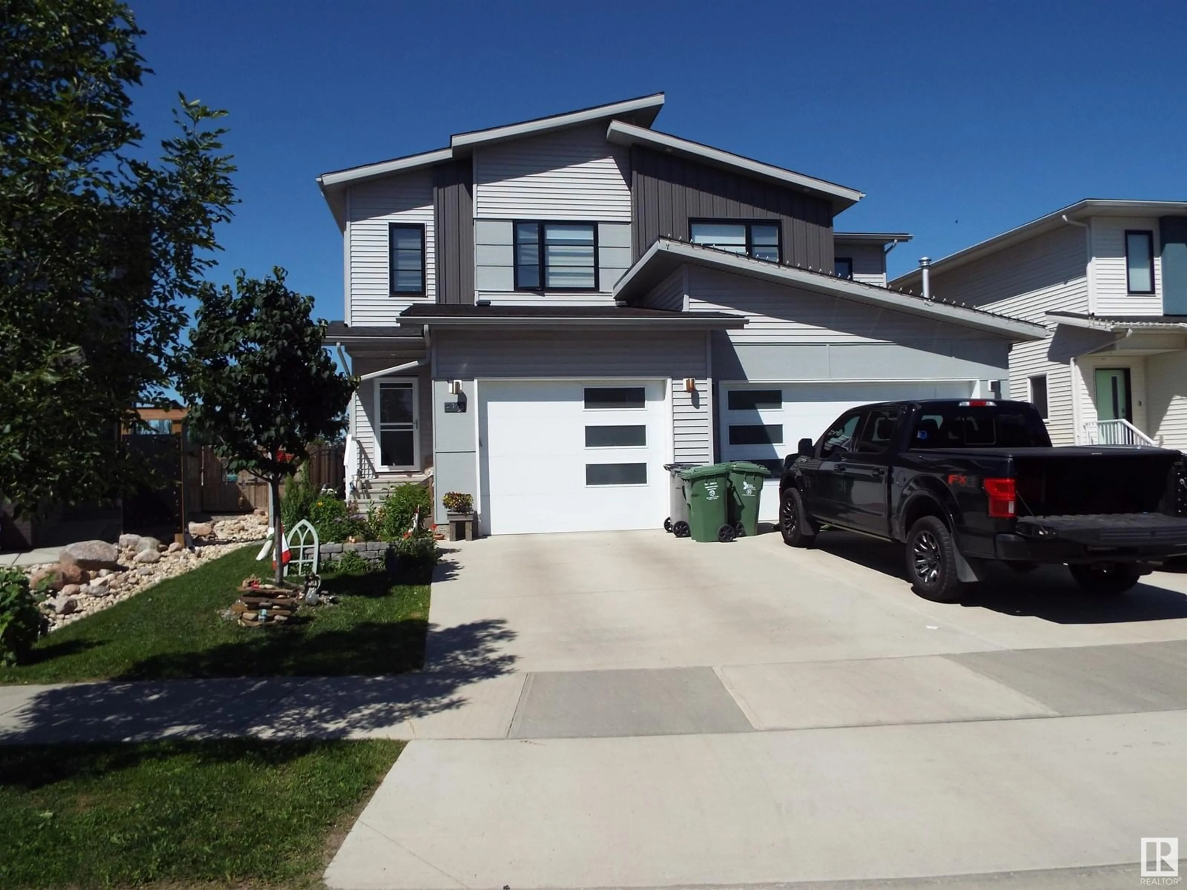 Home with vinyl exterior material, street for 4706 67 ST, Beaumont Alberta T4X1Z9