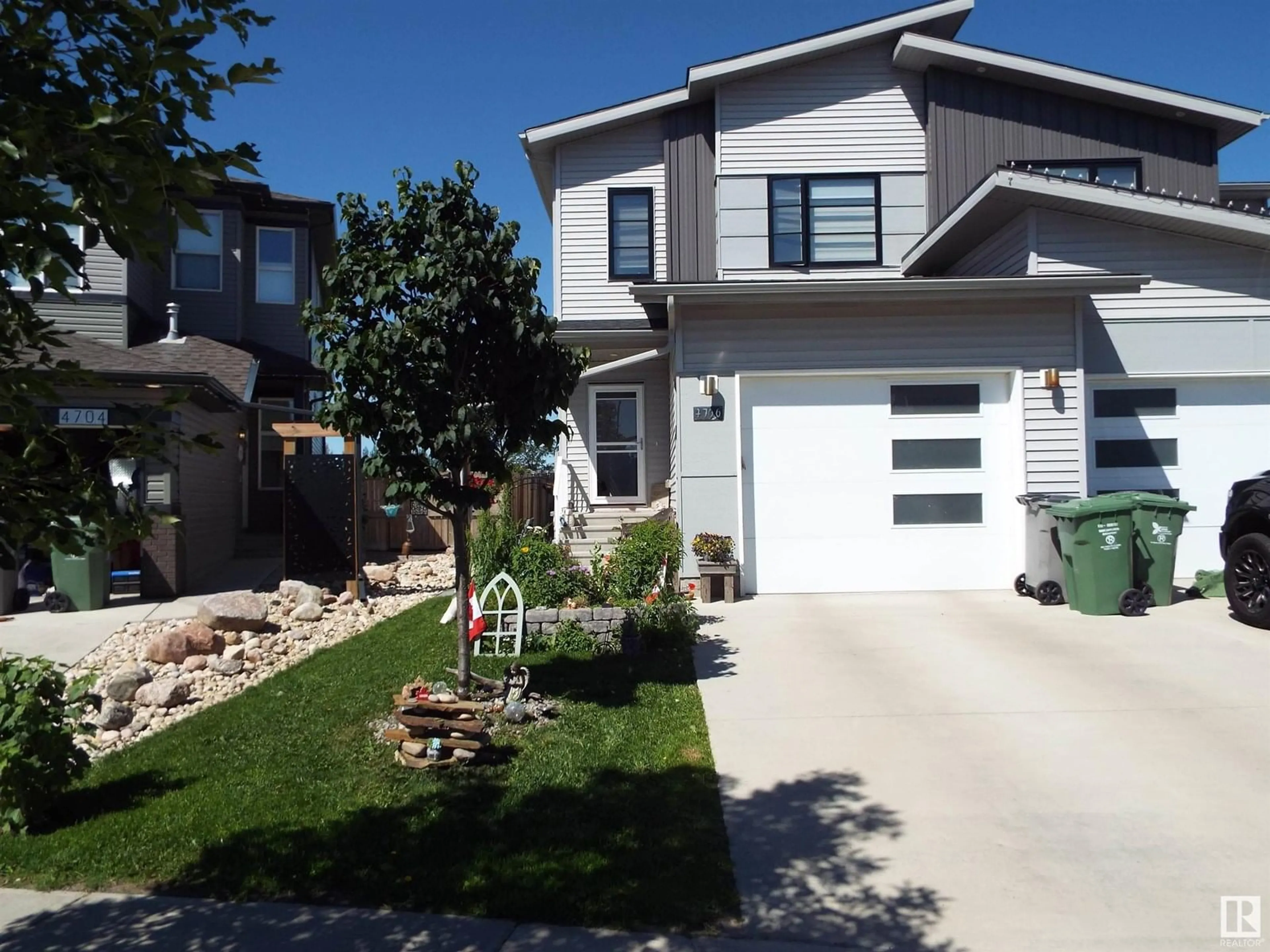 Home with vinyl exterior material, street for 4706 67 ST, Beaumont Alberta T4X1Z9