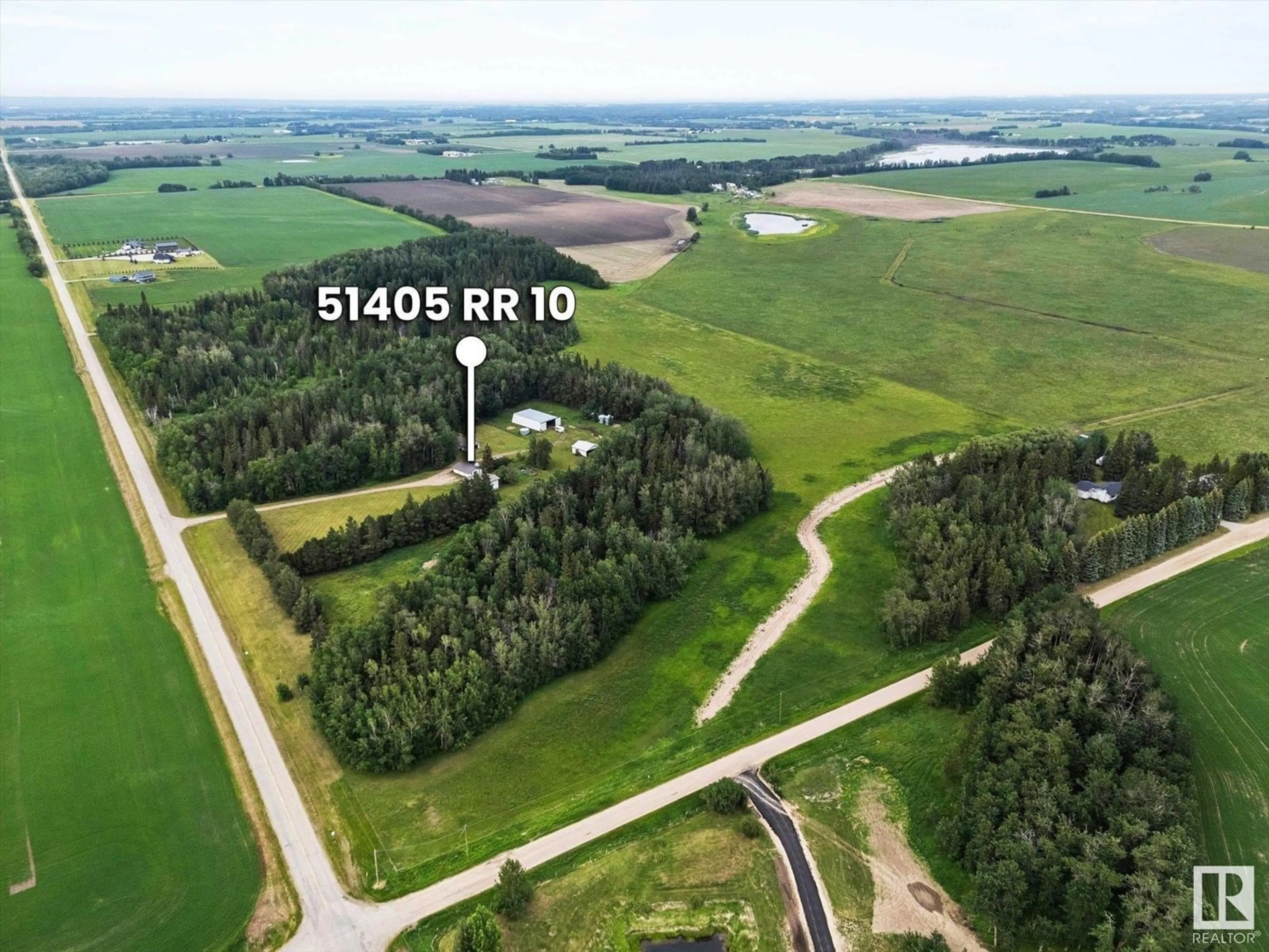 A pic from outside/outdoor area/front of a property/back of a property/a pic from drone, unknown for 51405 RGE ROAD 10, Rural Parkland County Alberta T7Y3J6