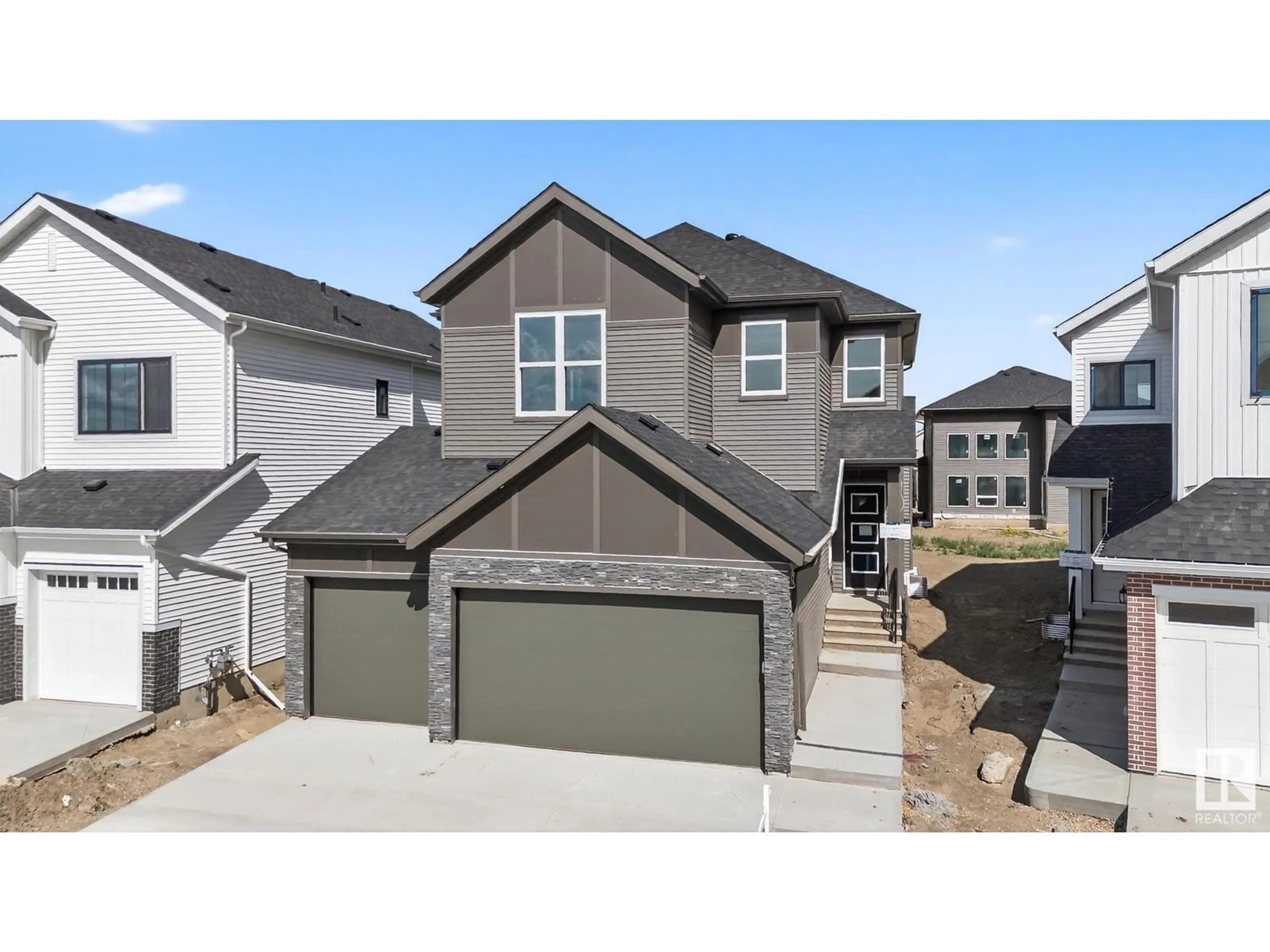 Home with vinyl exterior material, street for 17119 3 ST, Edmonton Alberta T5Y4G8