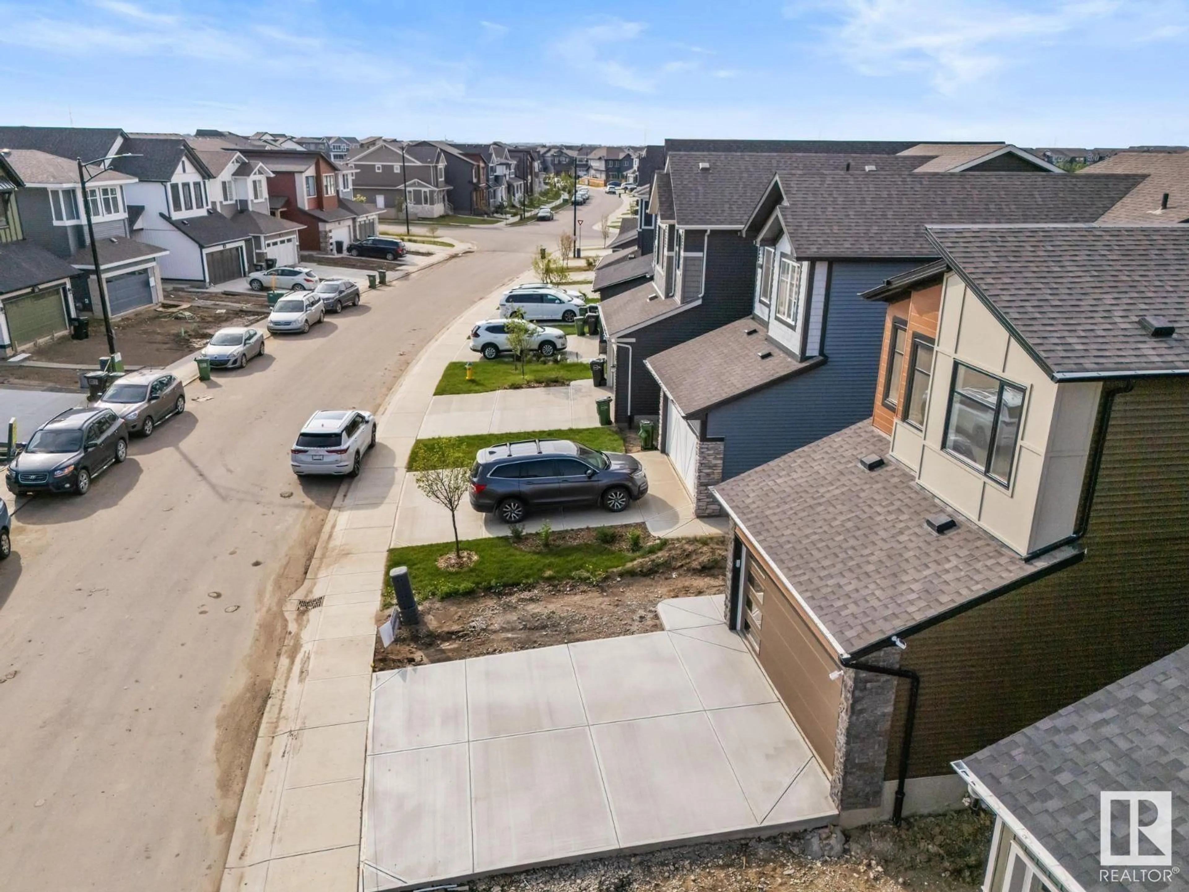 A pic from outside/outdoor area/front of a property/back of a property/a pic from drone, street for 2320 MUCKLEPLUM WY, Edmonton Alberta T6X3G7