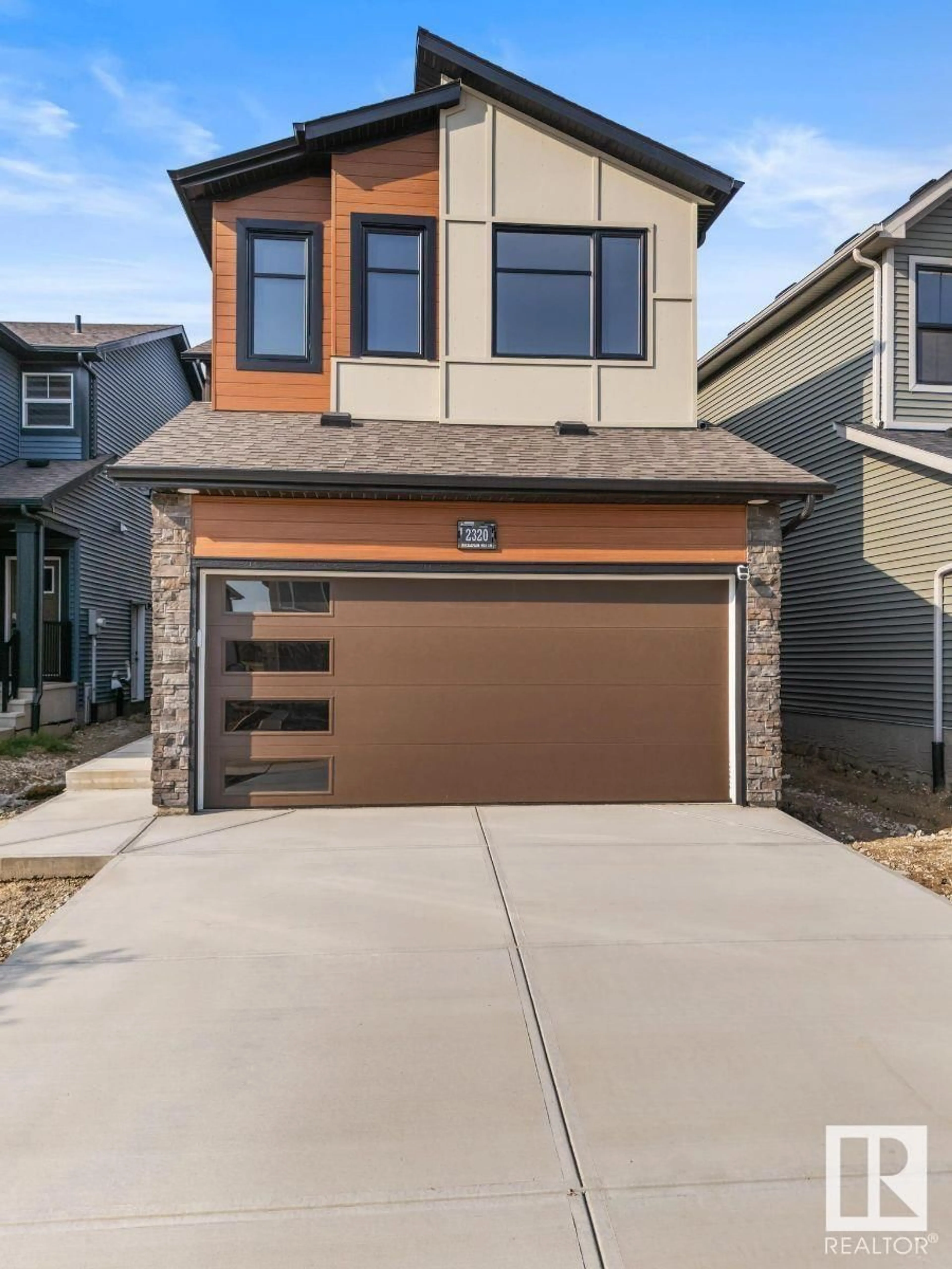 Home with brick exterior material, street for 2320 MUCKLEPLUM WY, Edmonton Alberta T6X3G7