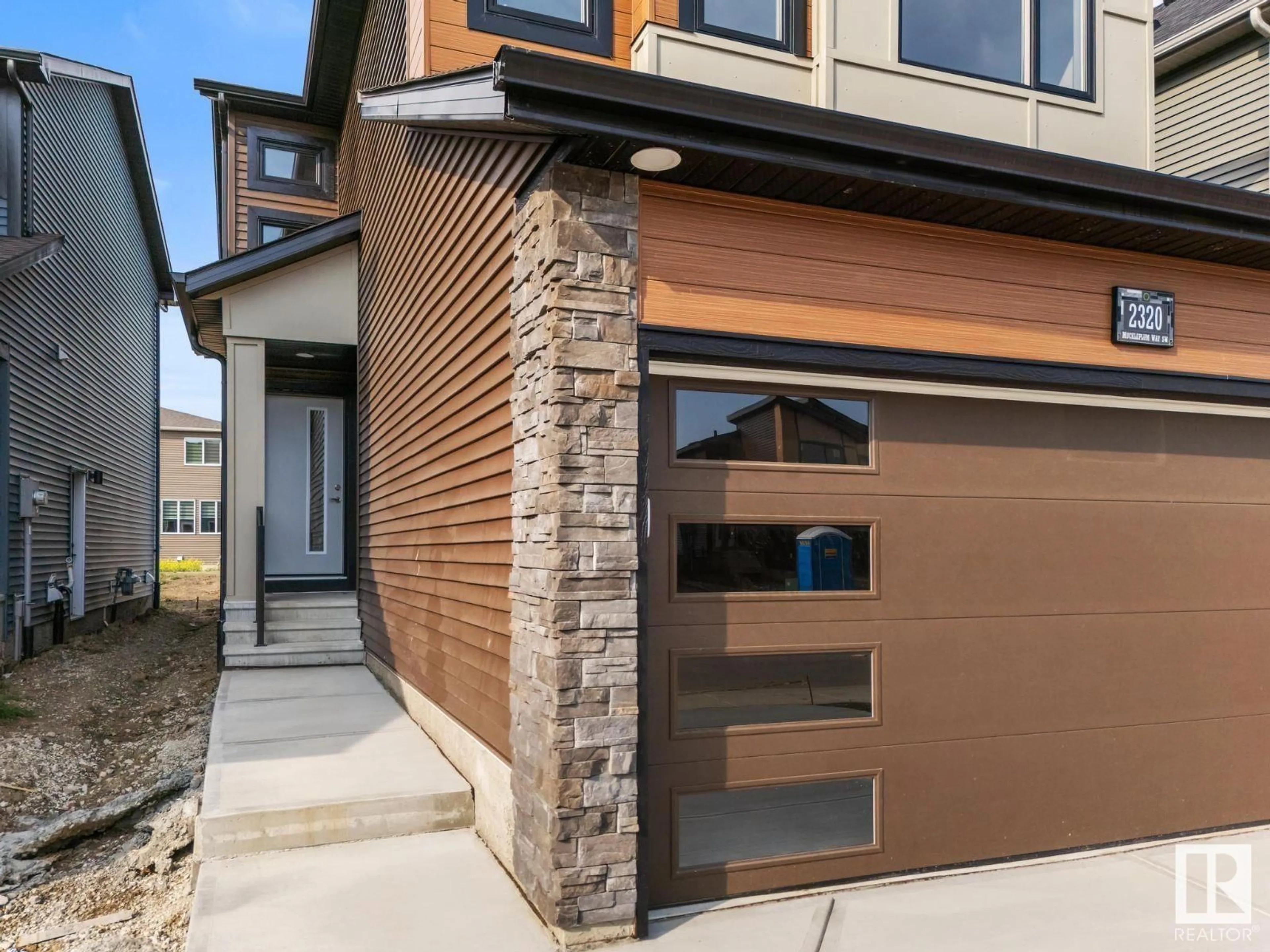 Home with brick exterior material, street for 2320 MUCKLEPLUM WY, Edmonton Alberta T6X3G7