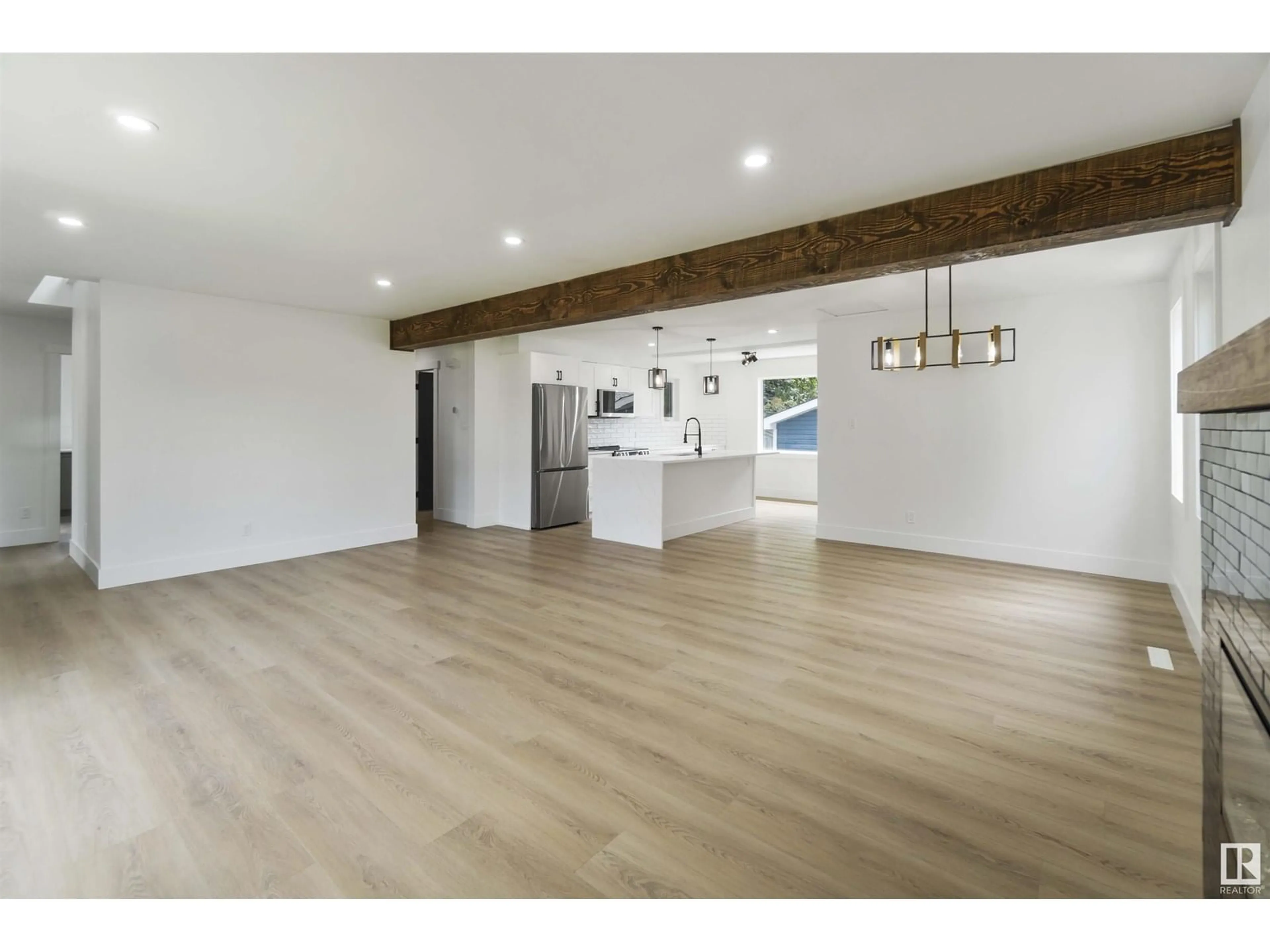 Open concept kitchen, wood/laminate floor for 6719 95 AV, Edmonton Alberta T6B1A6