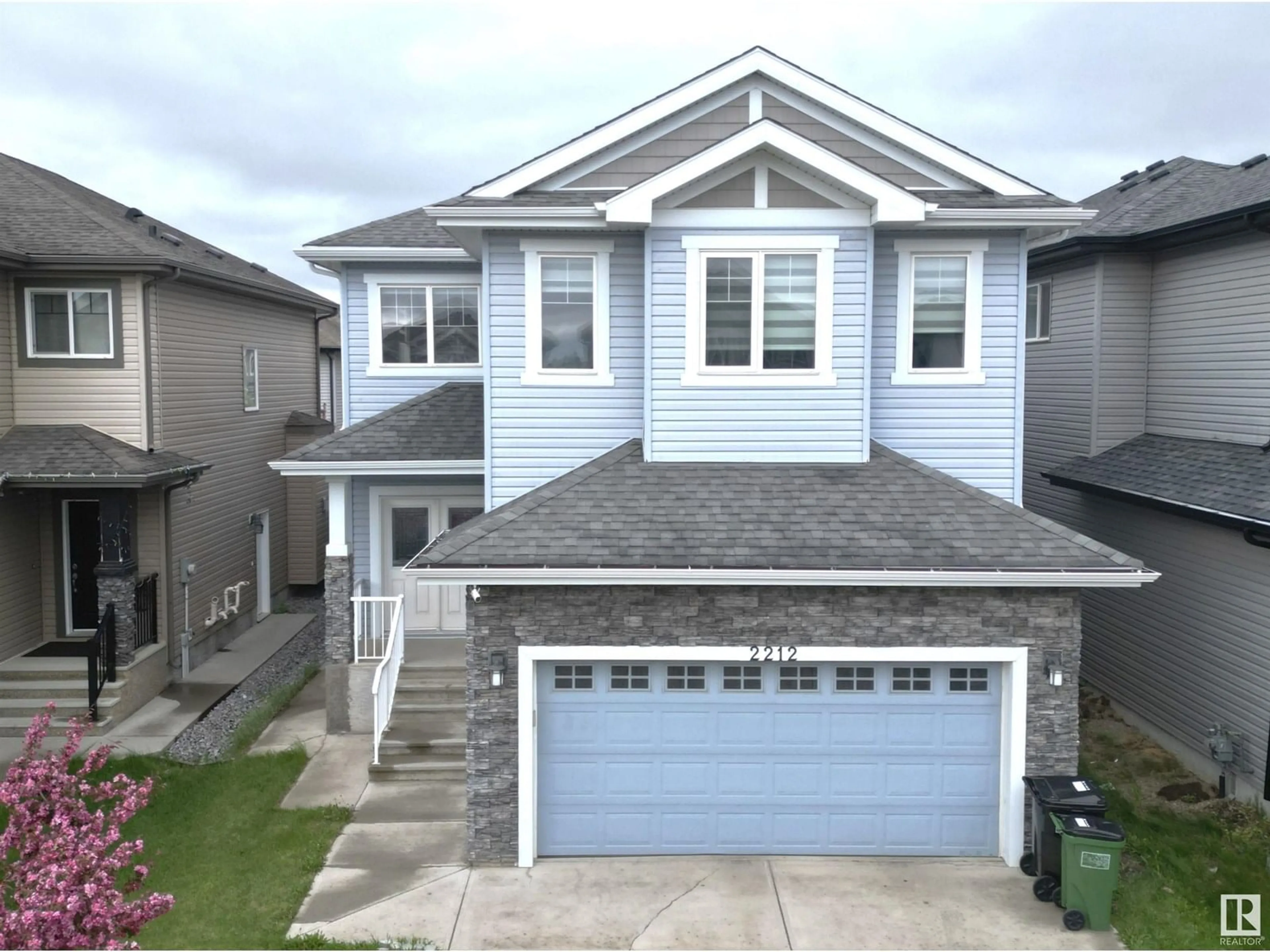 Home with vinyl exterior material, street for 2212 22 ST, Edmonton Alberta T6T0Z1