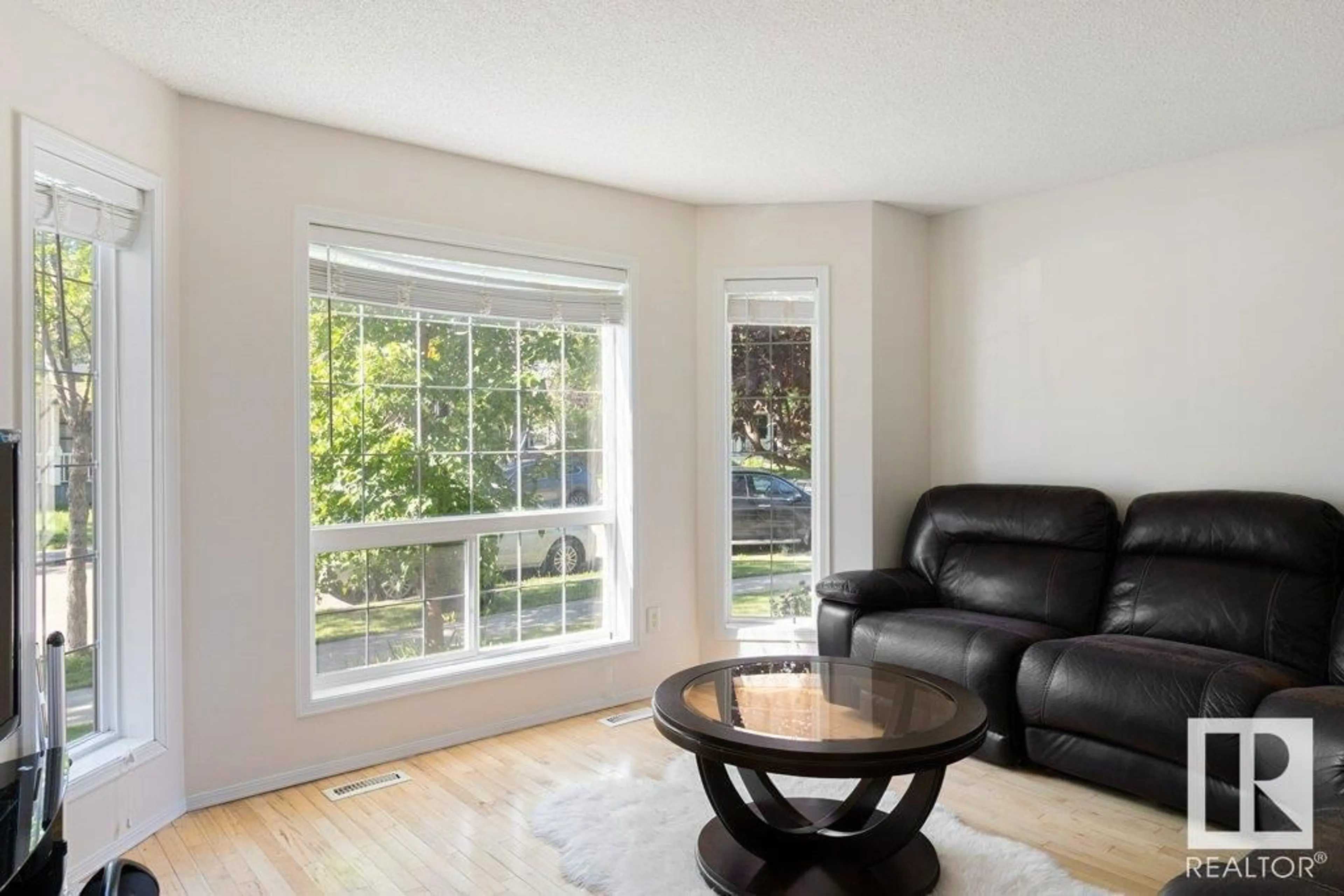 Living room with furniture, wood/laminate floor for 20150 53 AV, Edmonton Alberta T6M2W3