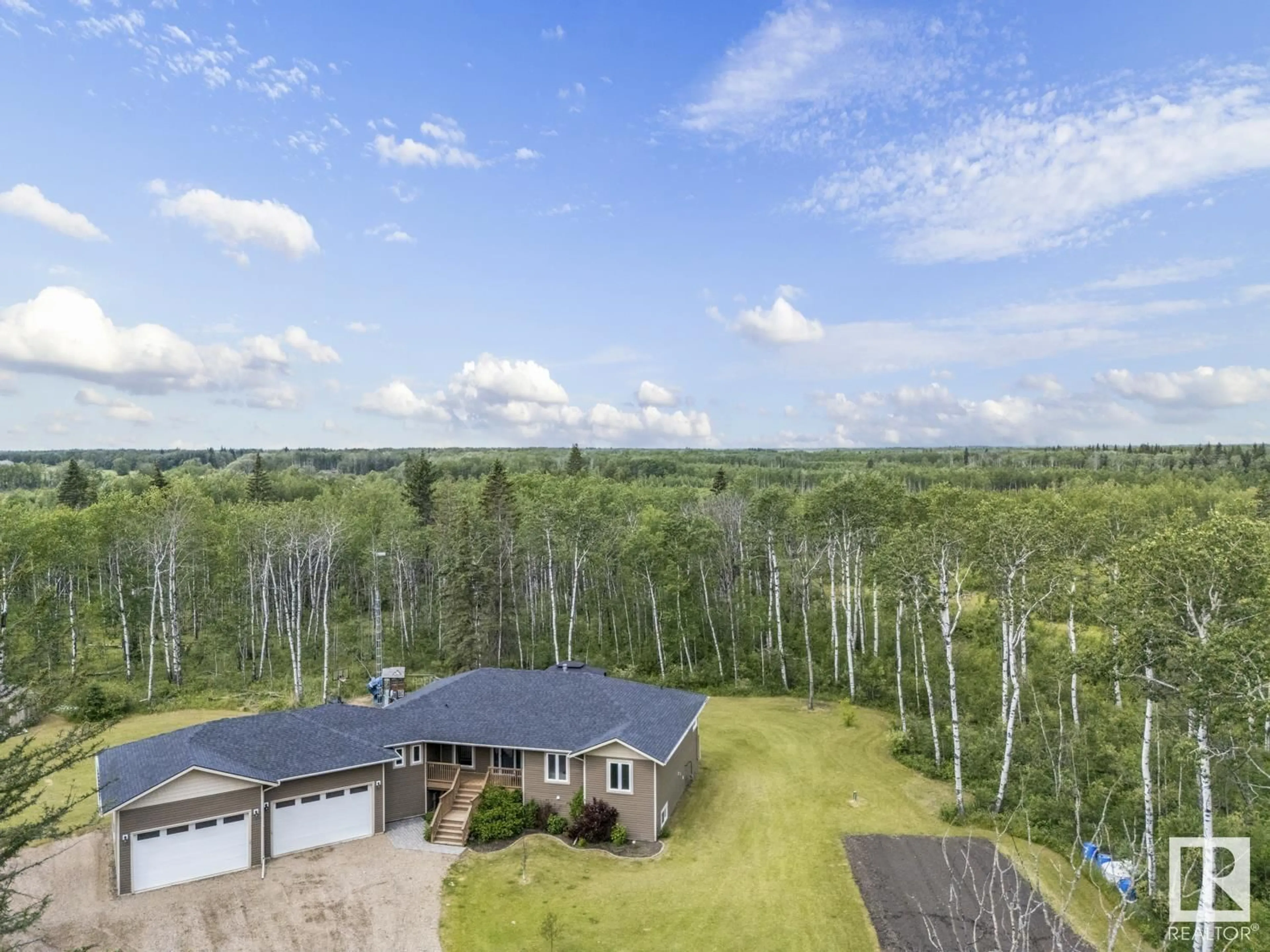 A pic from outside/outdoor area/front of a property/back of a property/a pic from drone, forest/trees view for 43506 TWP RD 630, Rural Bonnyville M.D. Alberta T9N2J6