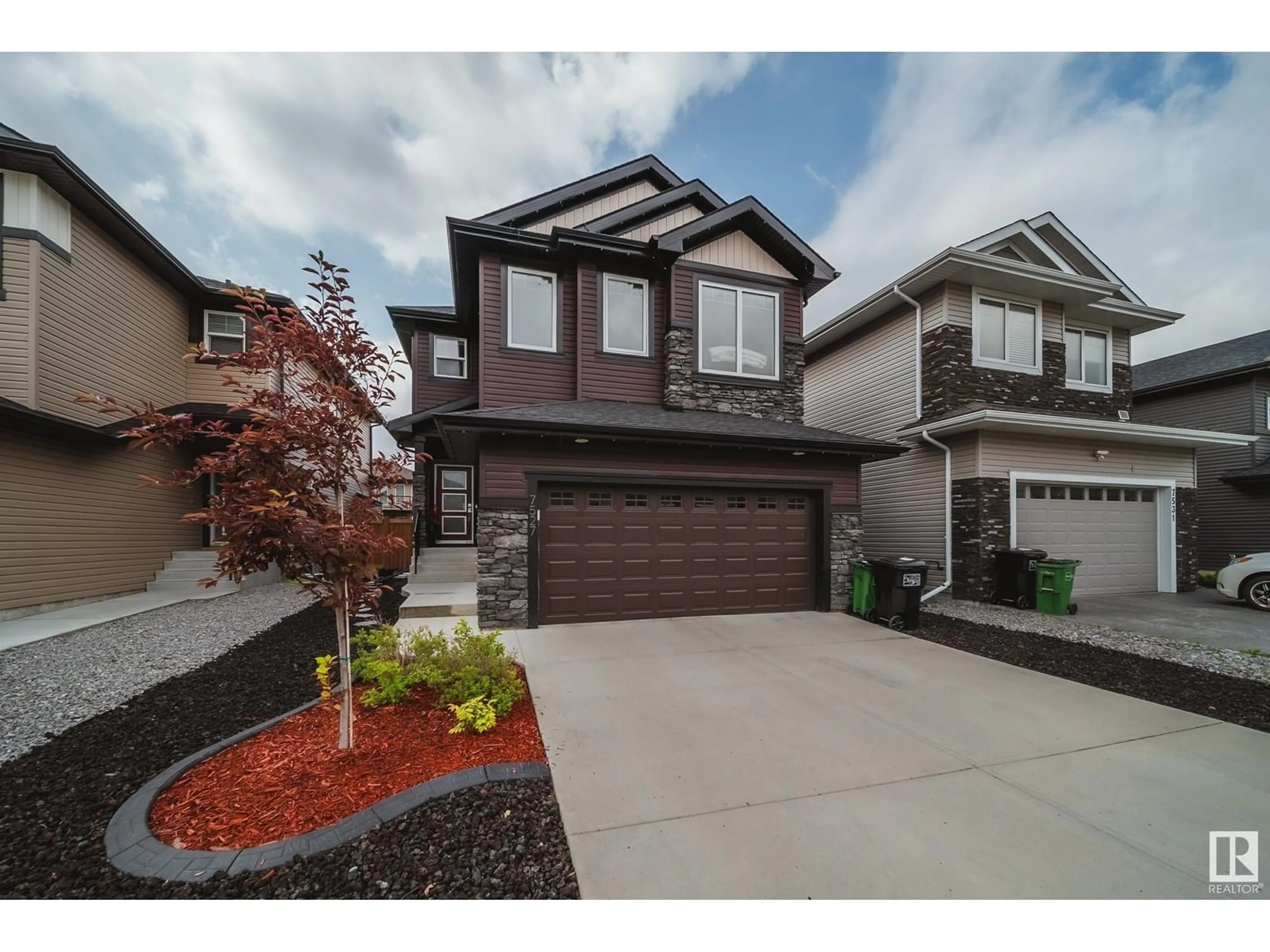 Home with vinyl exterior material, street for NW - 7527 174 AV, Edmonton Alberta T5Z0J7