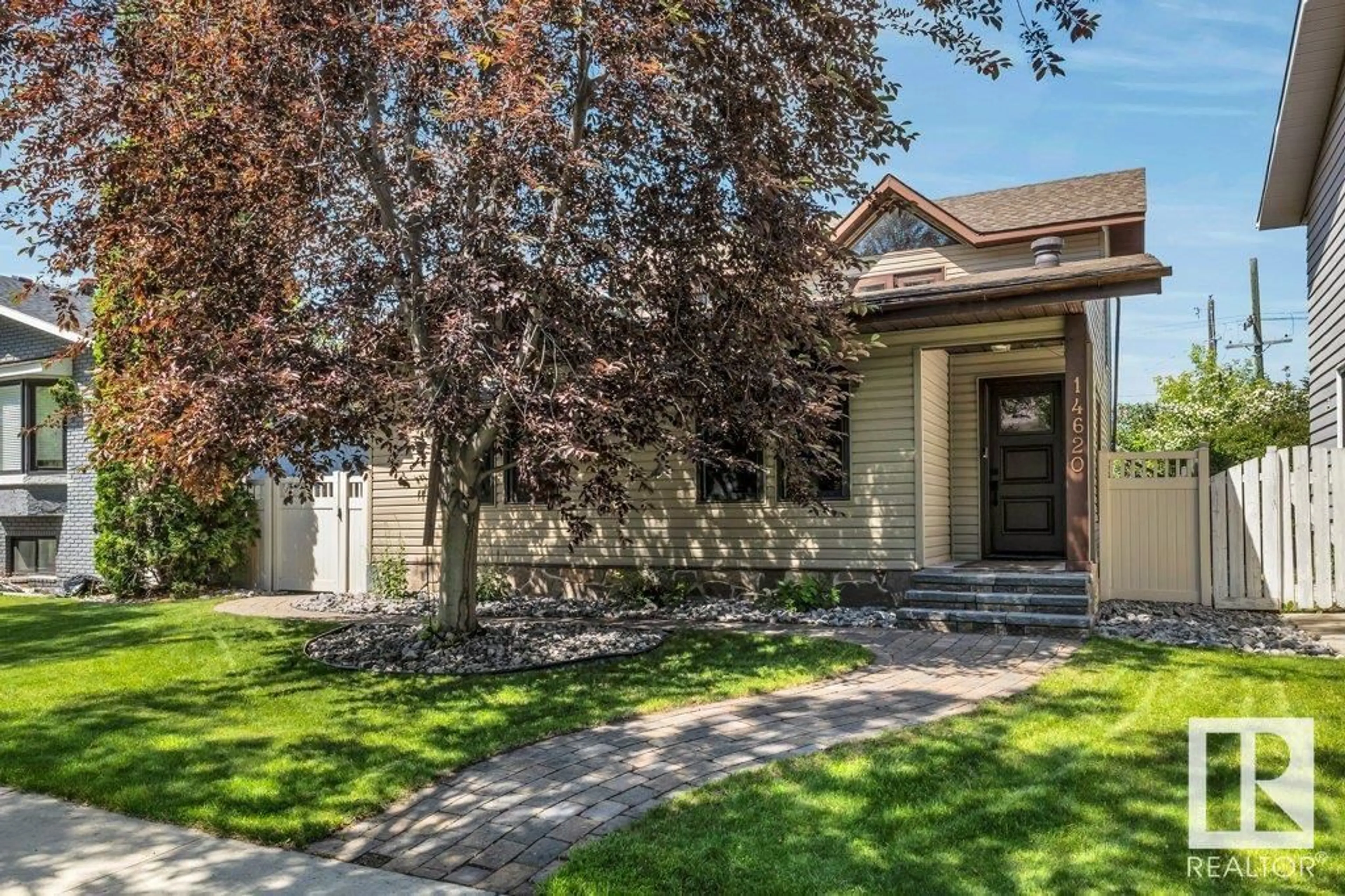 Home with vinyl exterior material, street for 14620 104 AV, Edmonton Alberta T5N0X4