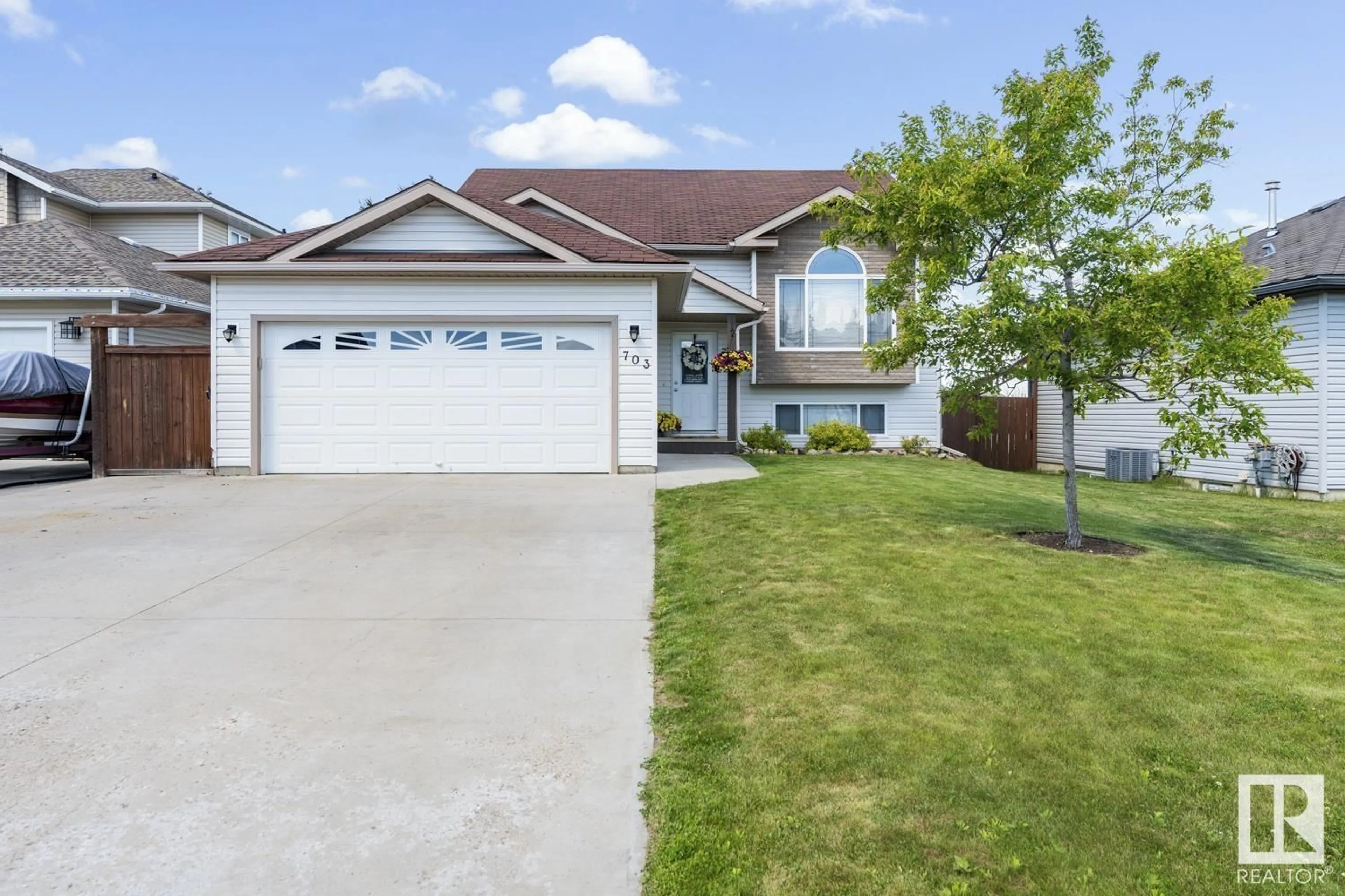 Home with vinyl exterior material, street for 703 SPARROW CL, Cold Lake Alberta T9M2B7