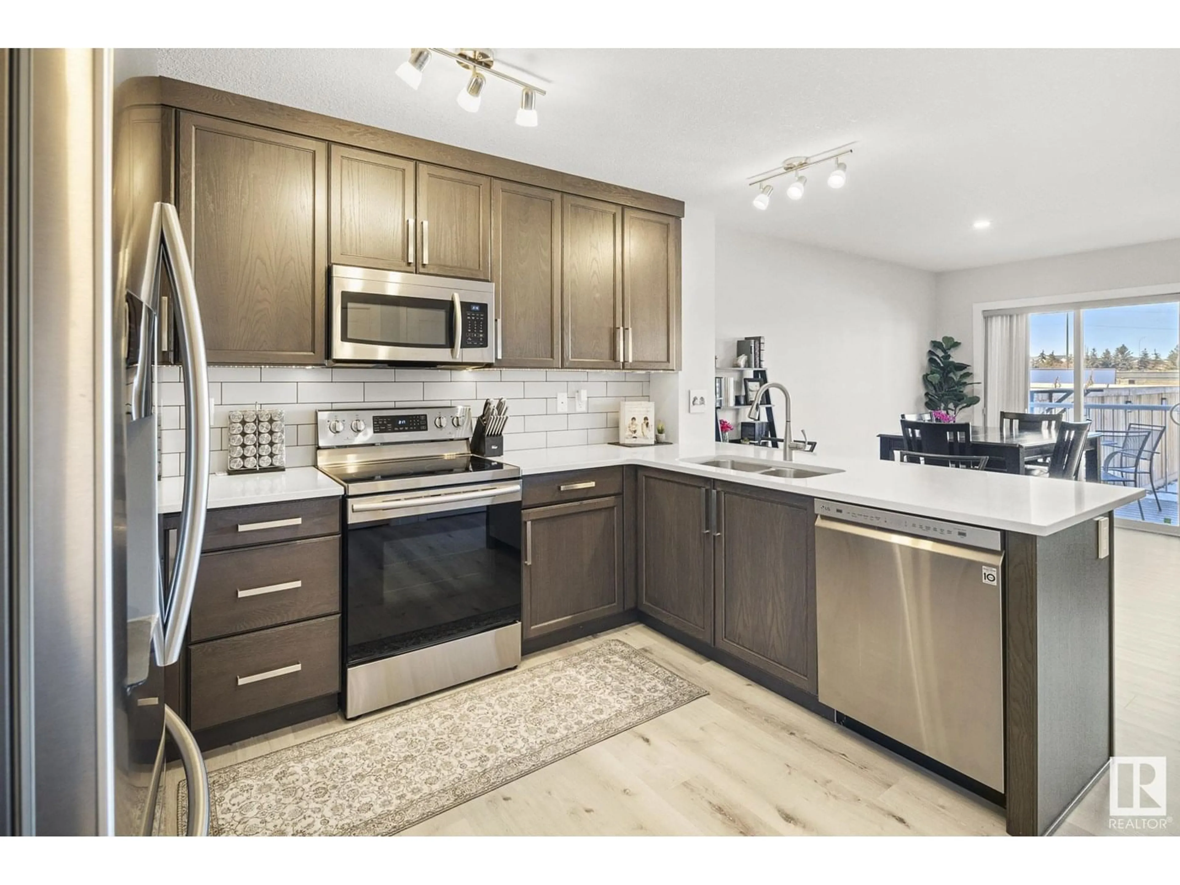 Open concept kitchen, ceramic/tile floor for 18 EBBERS CL, Edmonton Alberta T5Y3Y6